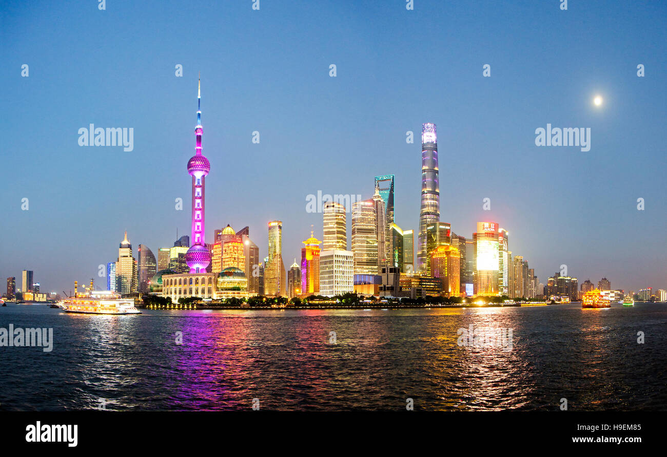 Night View of Shanghai New Skyline of Cityscape in the golden sunshine. The Tallest building is Shanghai Tower located in Pudong Stock Photo