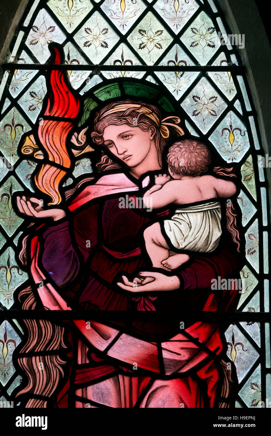 BurneJones stained glass depicting Charity at St. John the Evangelist Church, Whitfield