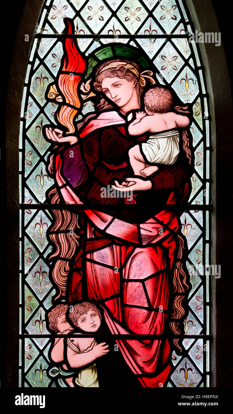 BurneJones stained glass depicting Charity at St. John the Evangelist