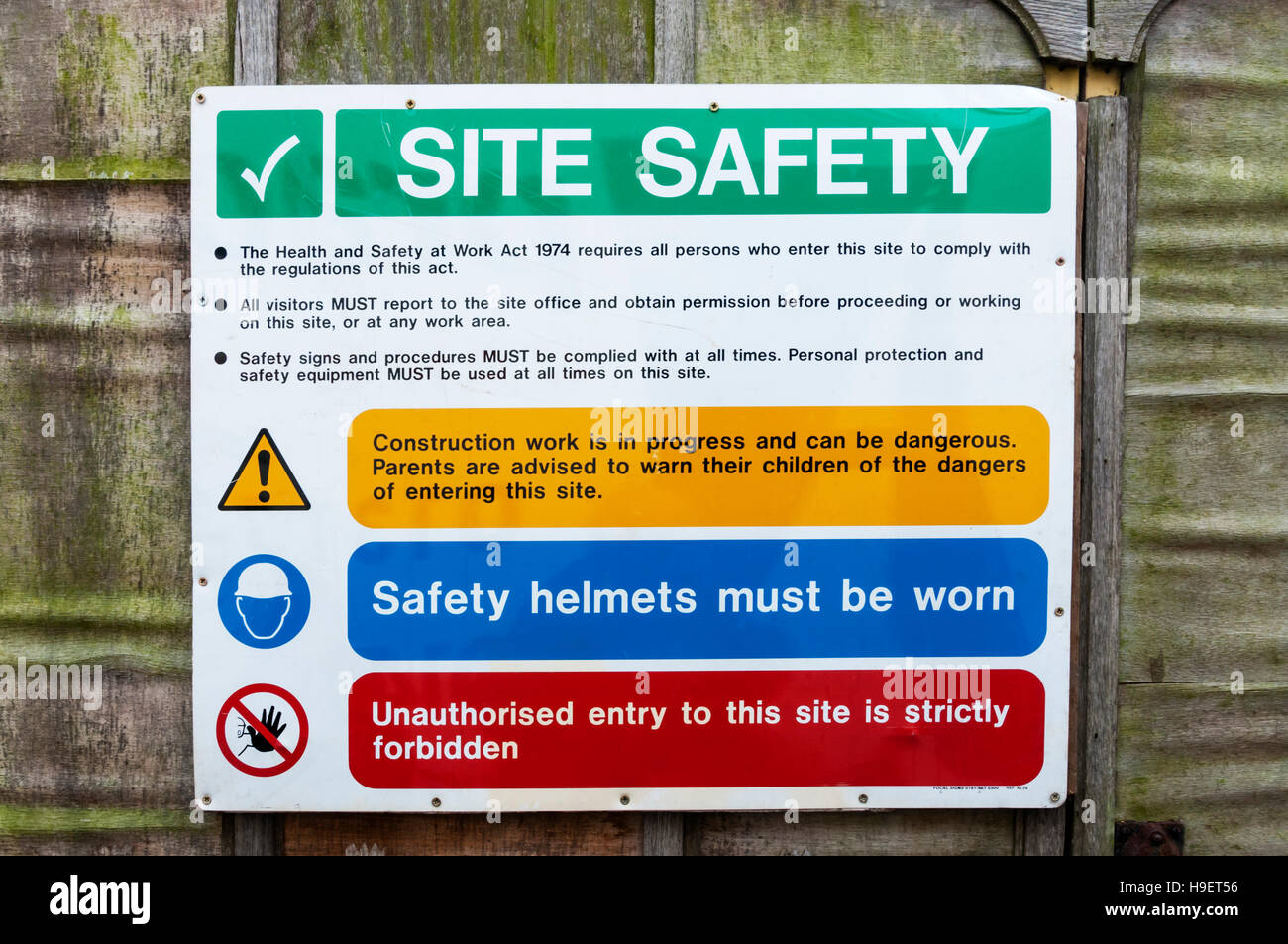 Site safety notices at the entrance to a construction site. Stock Photo