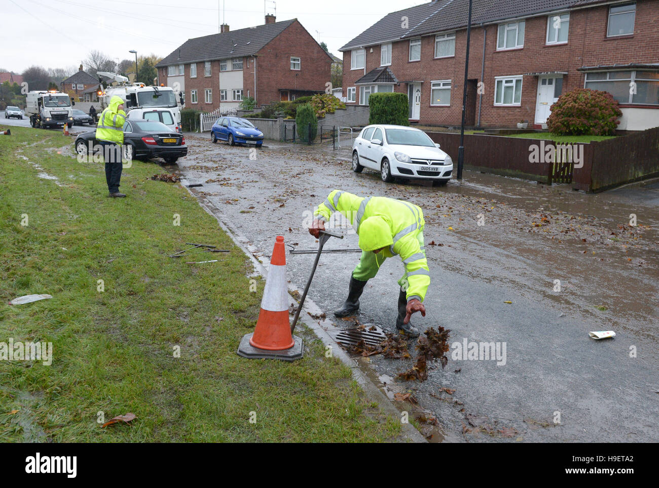 The clean up begins in Whitchurch Lane, Bristol, after heavy rain overnight, as wind and rain continue to blight parts of Britain threatening further travel chaos after torrential downpours caused flash-flooding and disruption across most of the country. Stock Photo