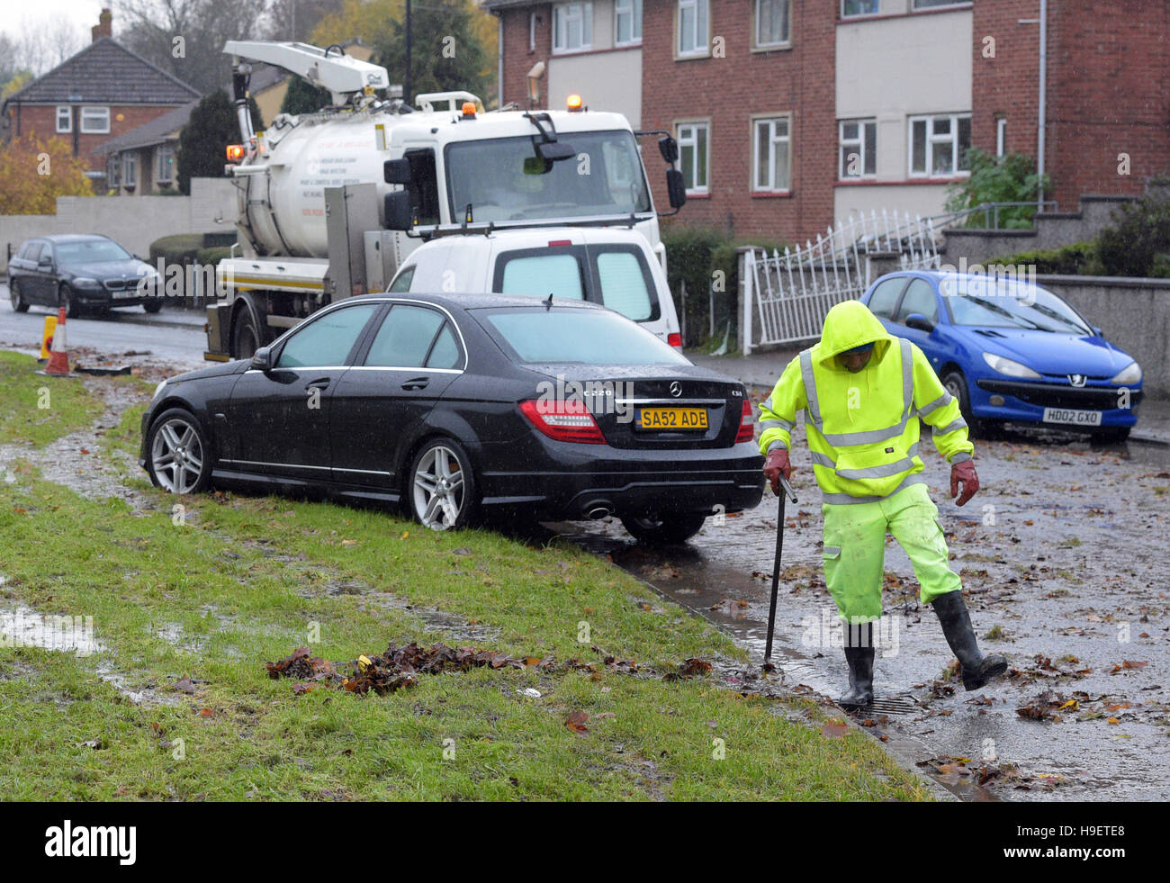 The clean up begins in Whitchurch Lane, Bristol, after heavy rain