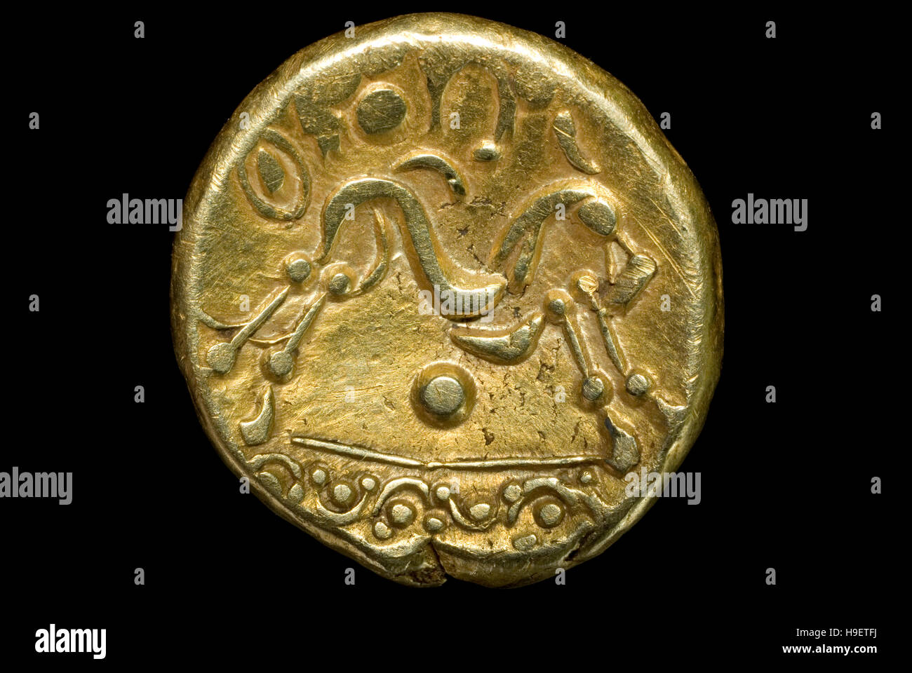 Iron age gold coin Stock Photo