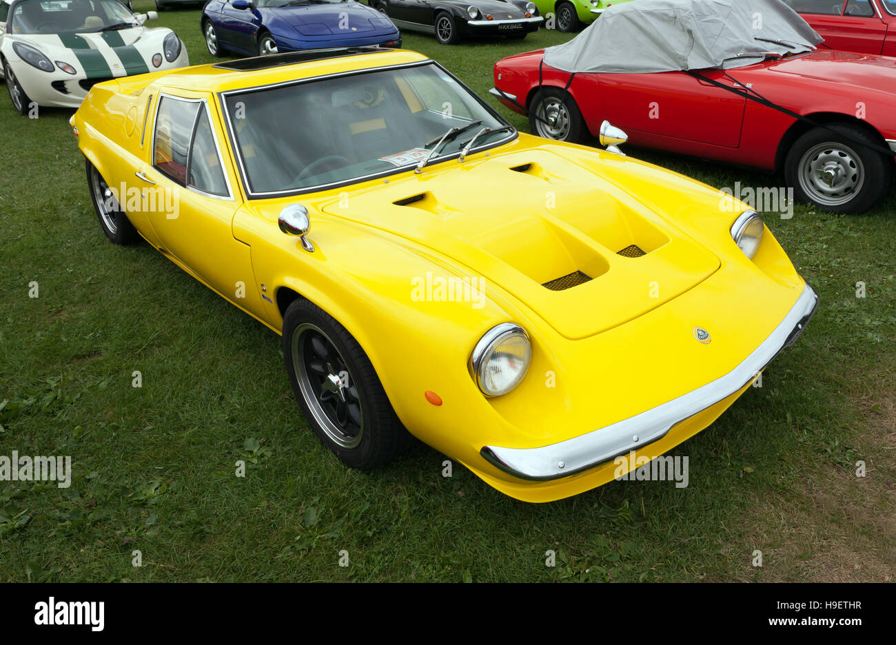 A yellow Lotus Europa 907 S on display in the Lotus Drivers club zone of the Silverstone Classic 2016 Stock Photo