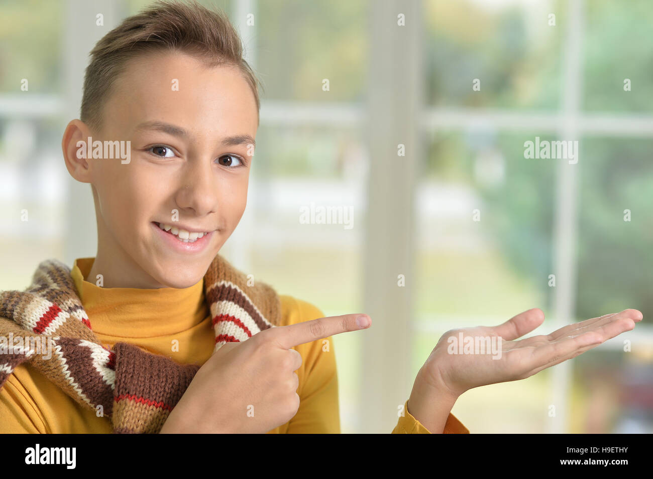 Teen boy pointing Stock Photo