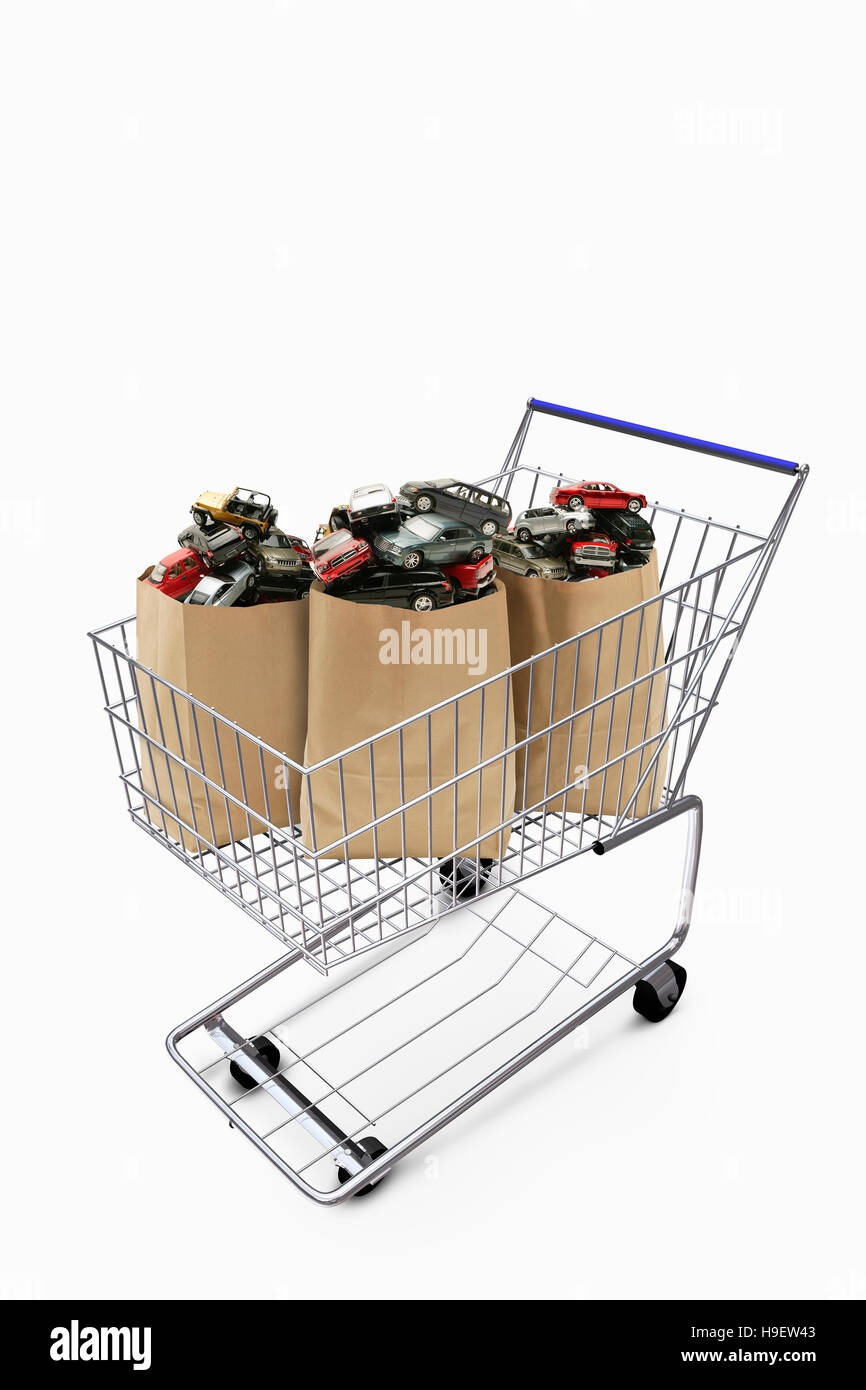 Paper bags in shopping cart filled with cars Stock Photo Alamy