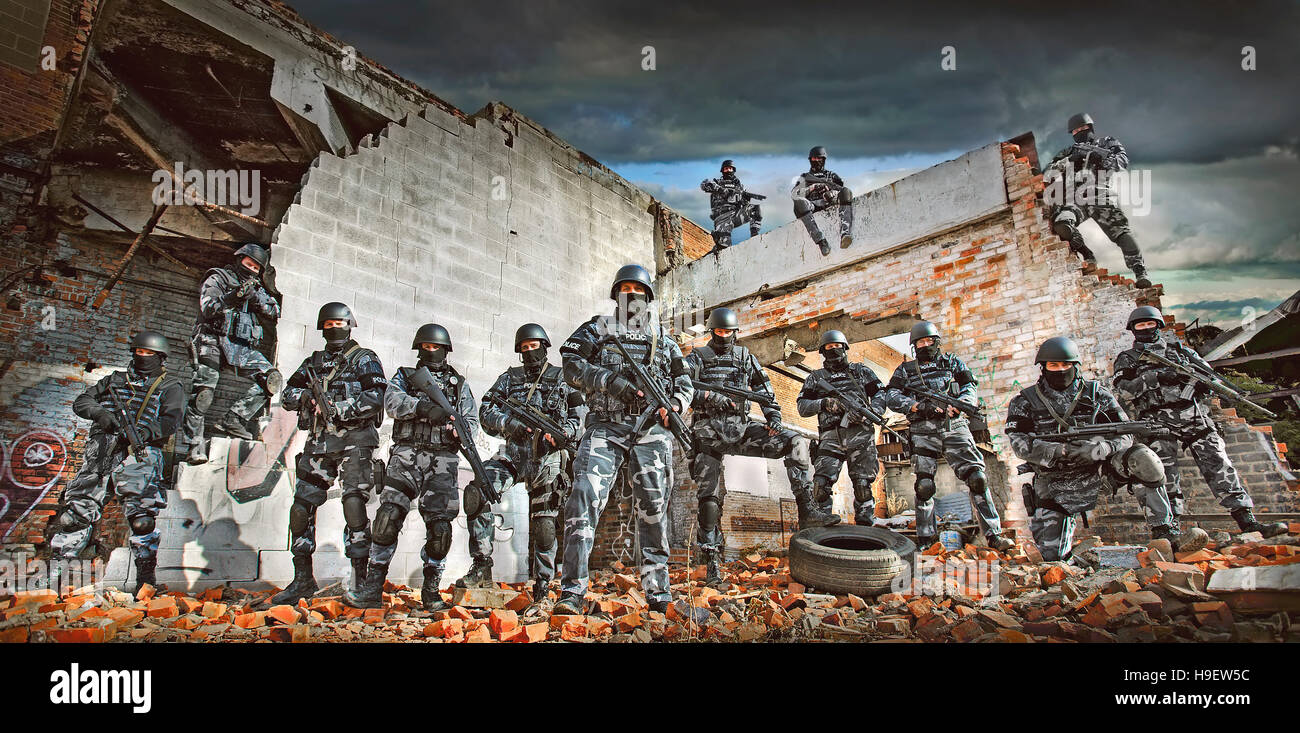 Soldiers wearing masks on ruins in battlefield Stock Photo Alamy
