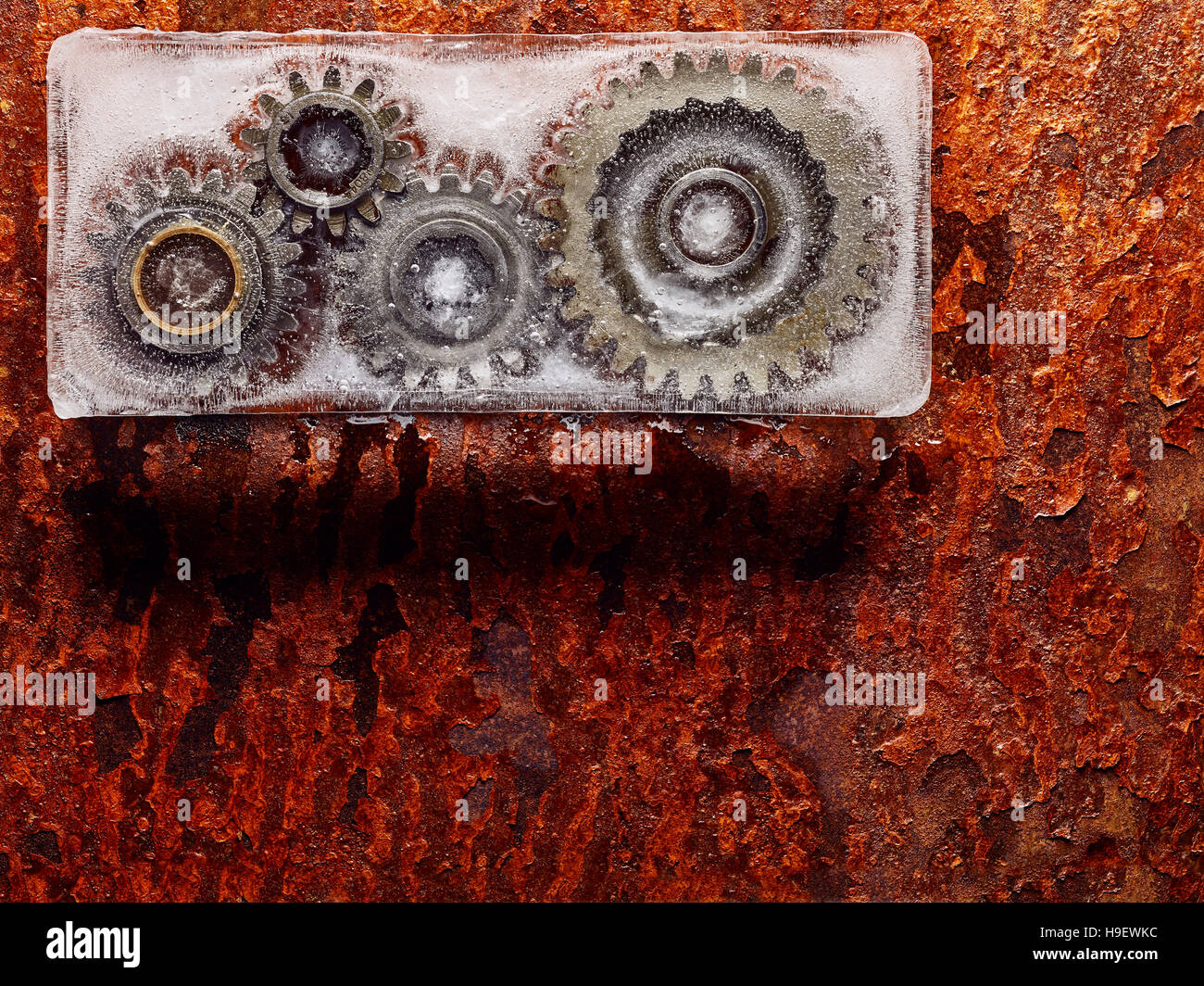 Gears frozen in ice Stock Photo Alamy