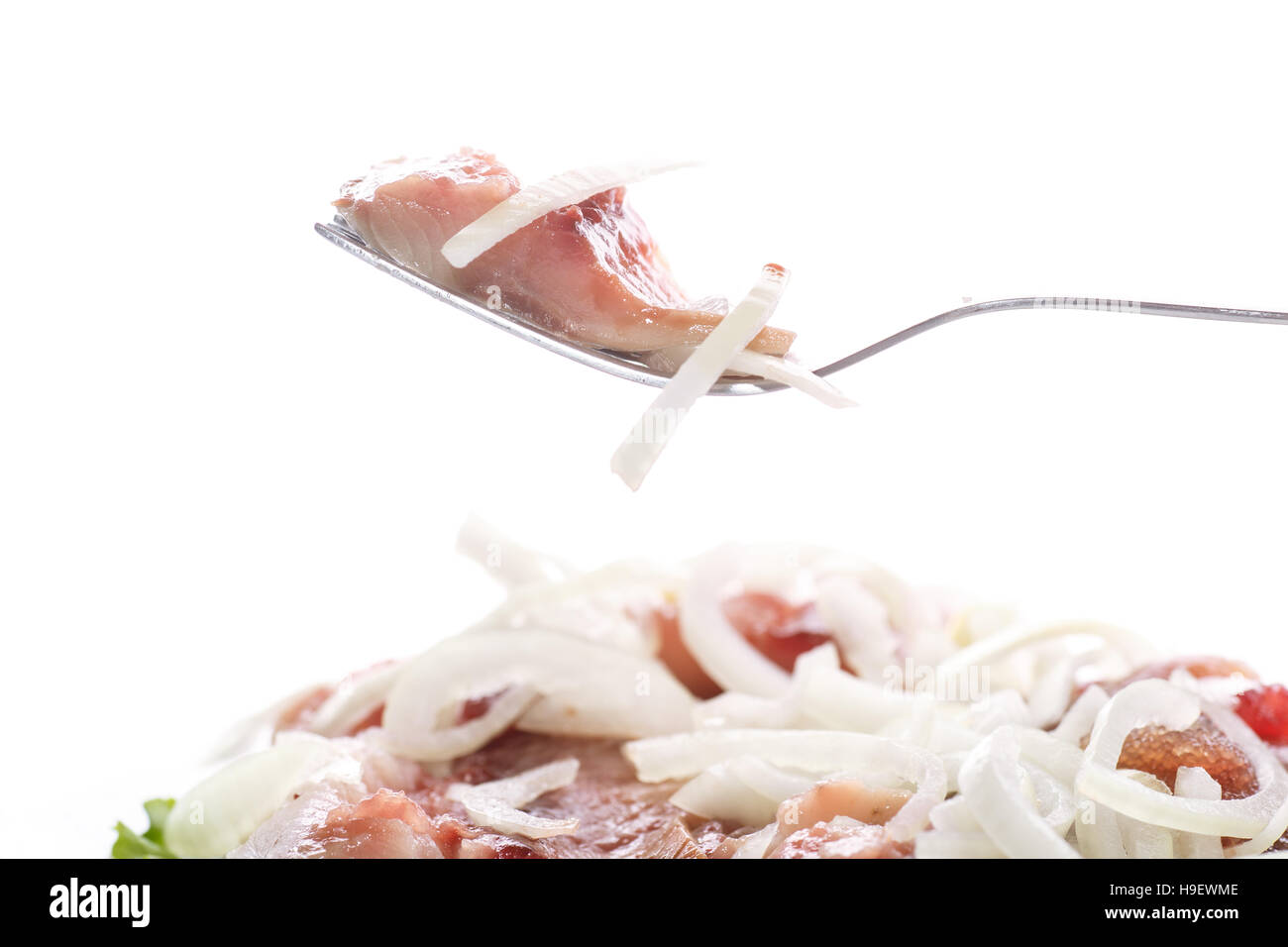 salted herring with onions Stock Photo Alamy