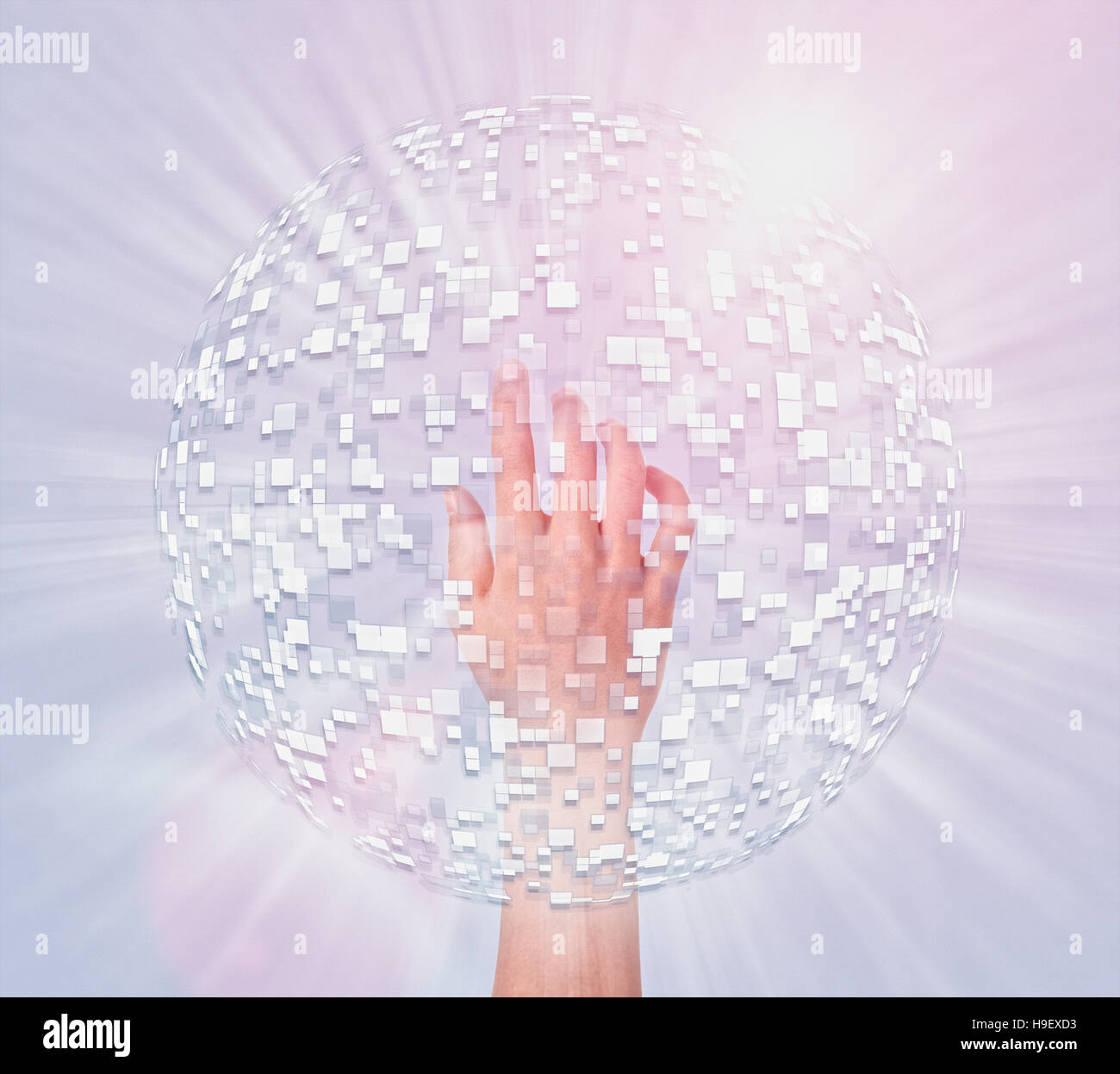 Hand of Mixed Race boy in hovering sphere of pixels Stock Photo