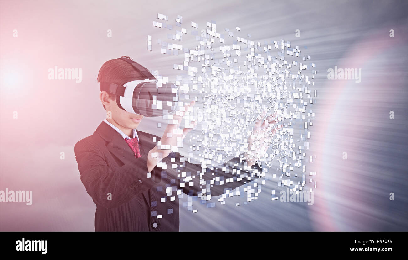 Mixed Race boy wearing suit using vr goggles Stock Photo
