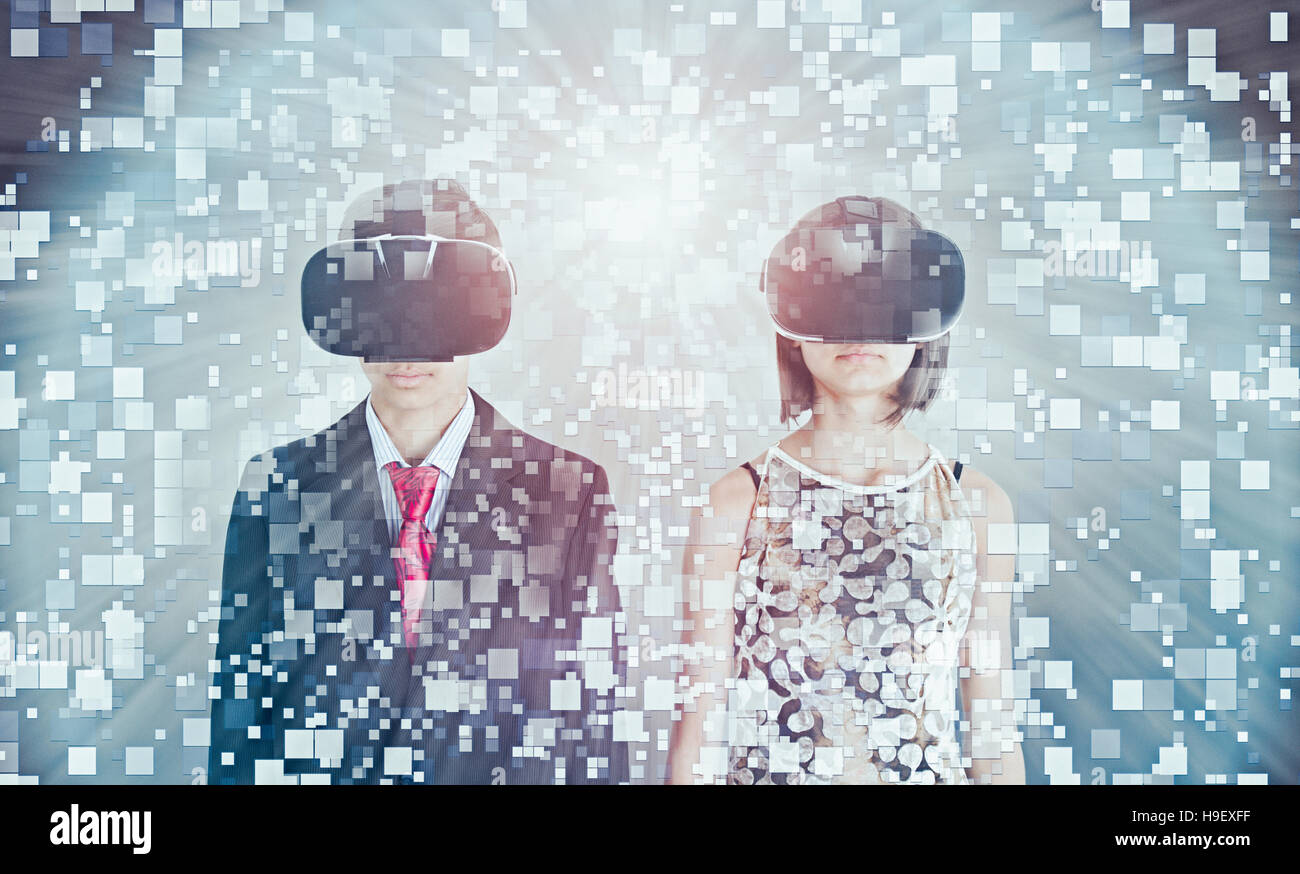 Mixed Race brother and sister using vr goggles Stock Photo