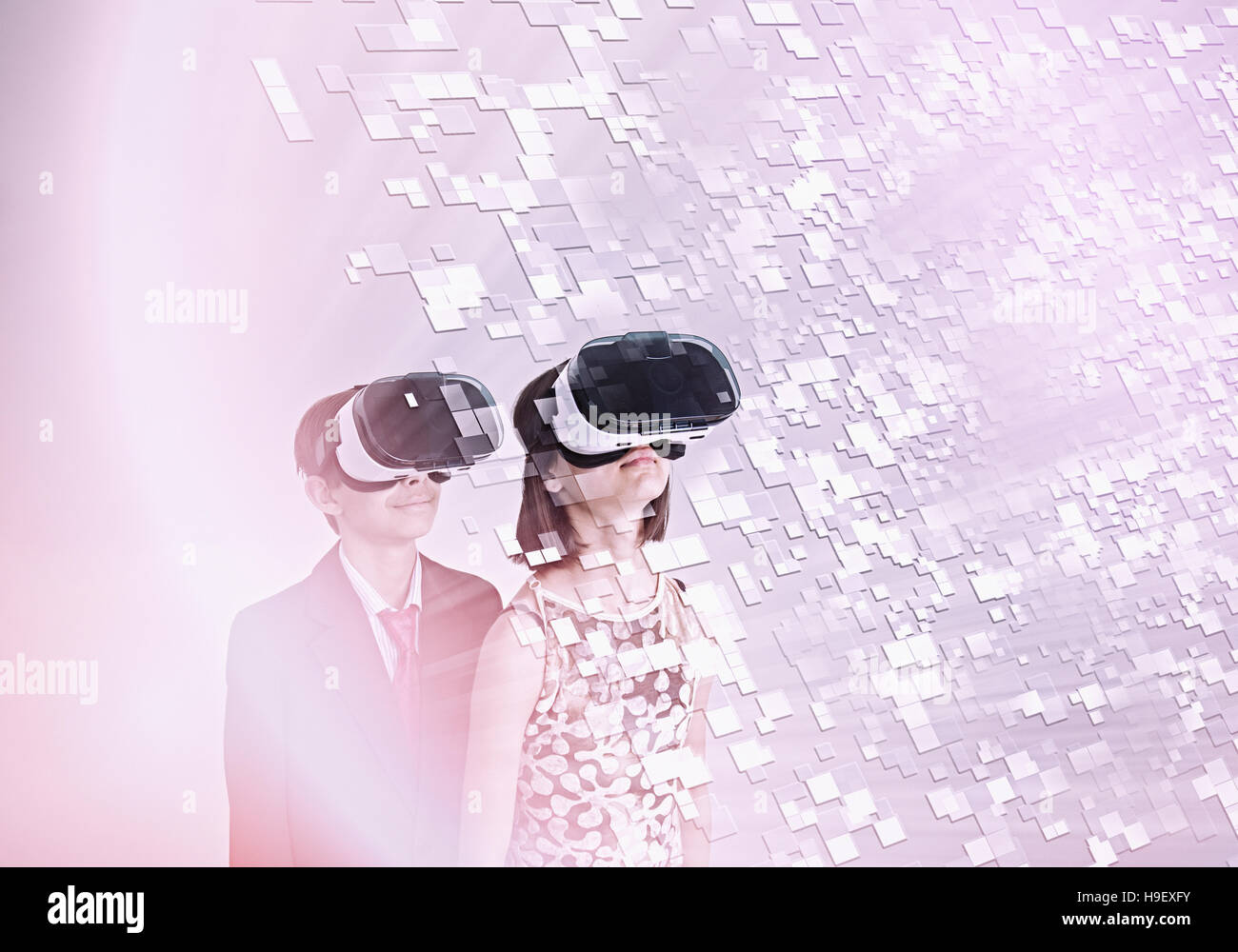 Mixed Race brother and sister using vr goggles Stock Photo