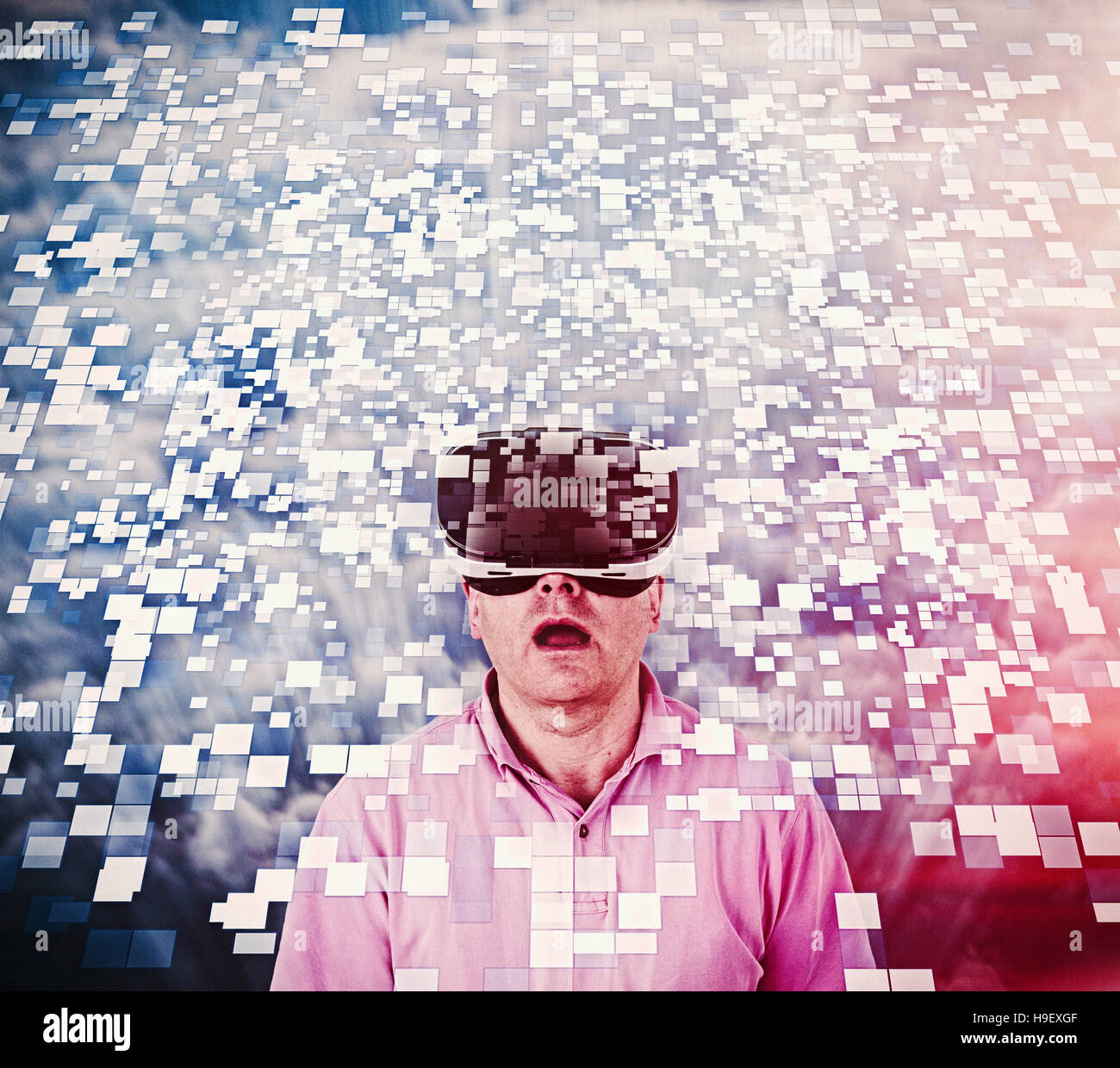 Caucasian man using vr goggles watching floating pixels Stock Photo