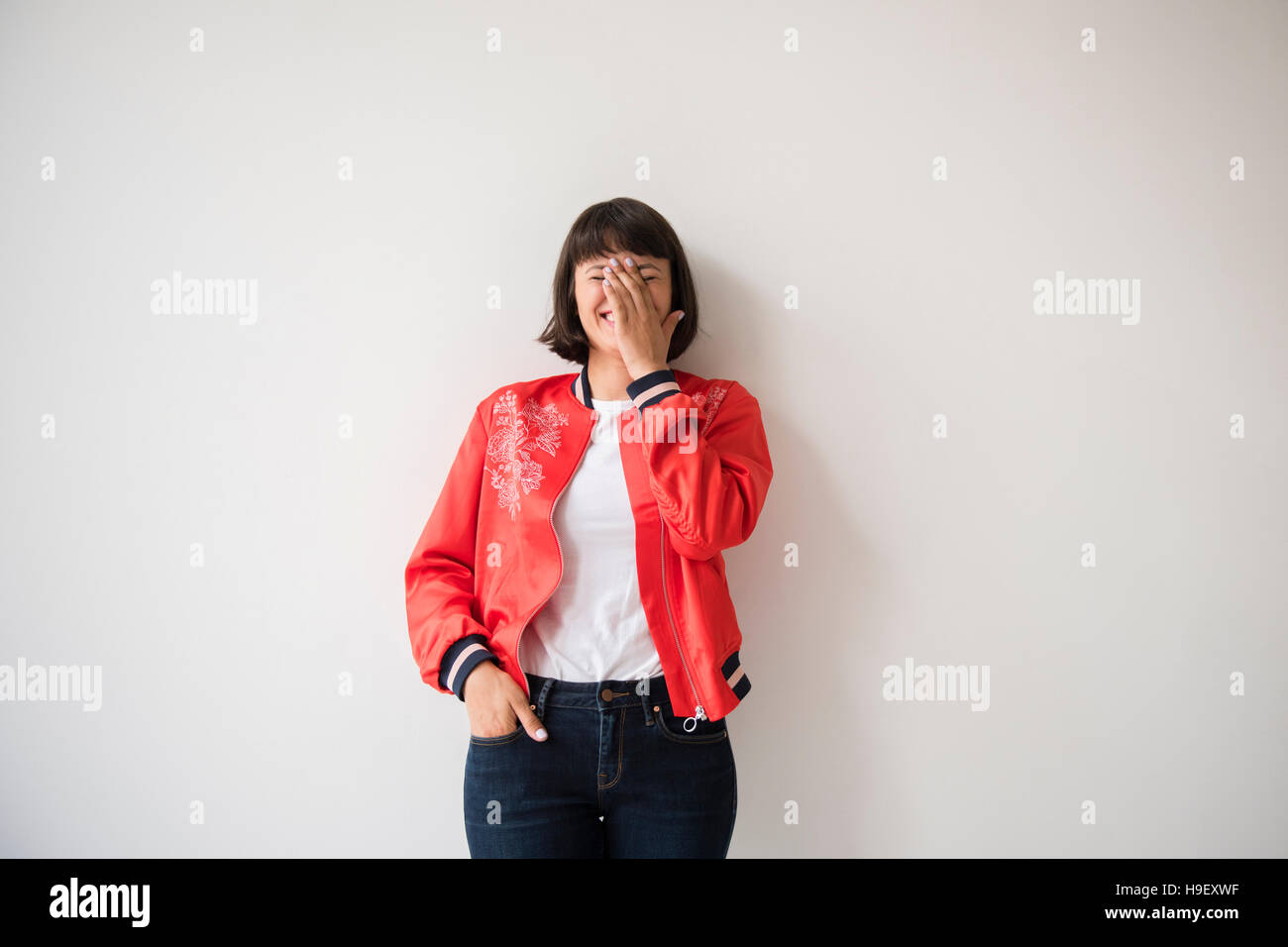 Person wearing red jacket hi-res stock photography and images - Alamy