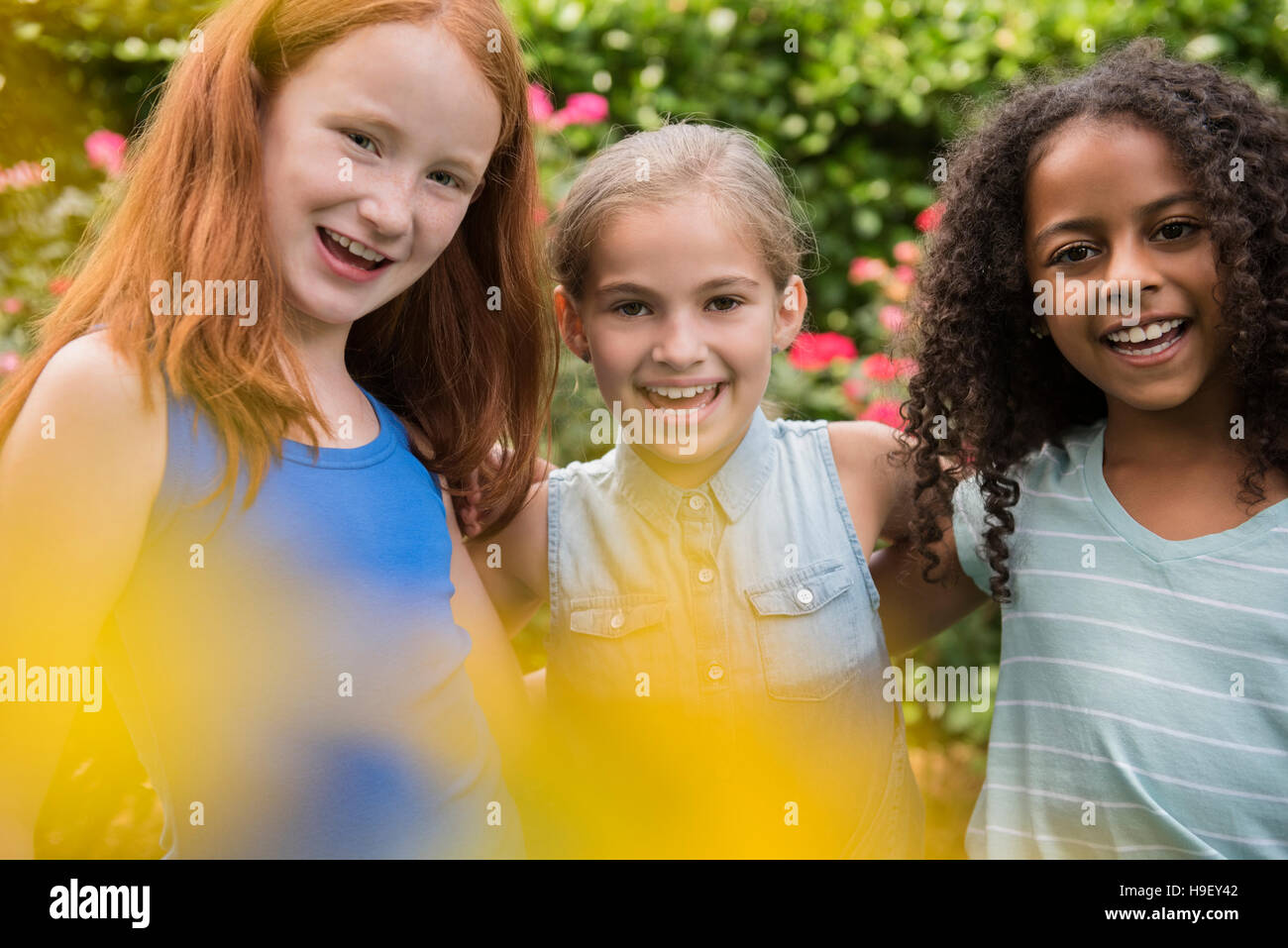 Portrait of smiling girls outdoors Stock Photo - Alamy