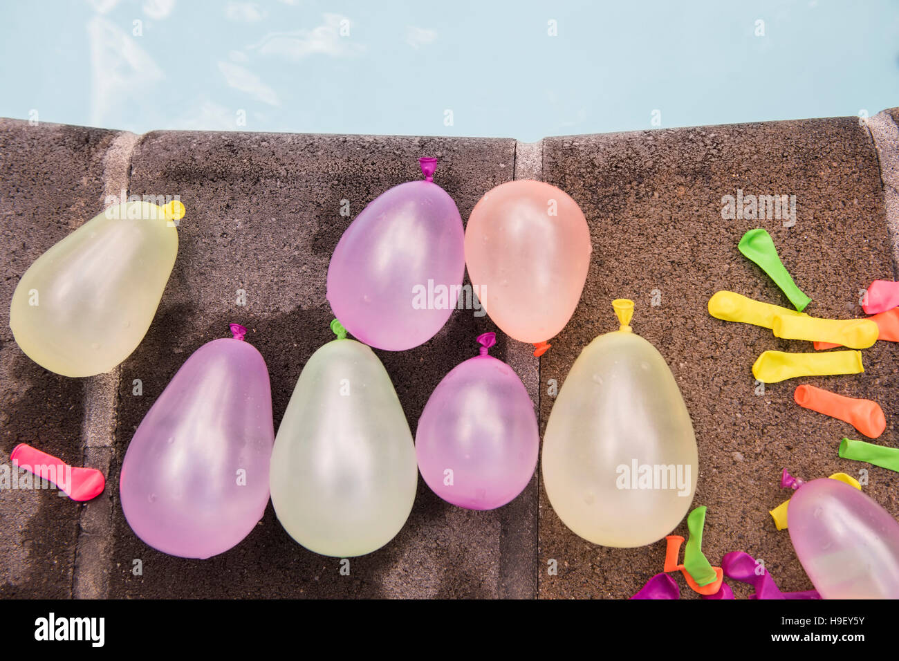 Water balloons at the edge of swimming pool Stock Photo Alamy