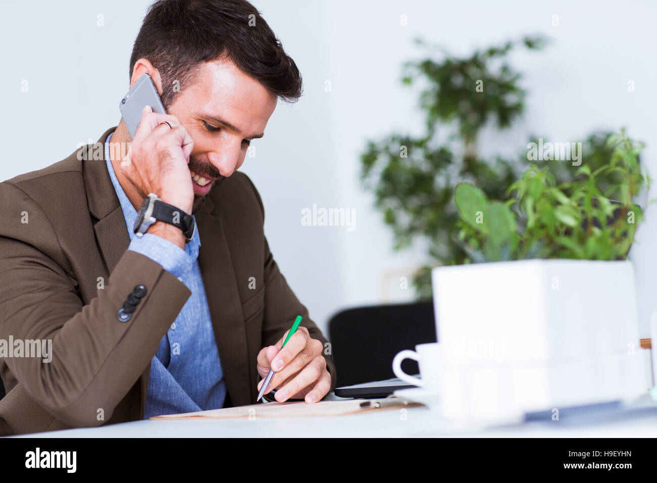 Man working in office Stock Photo - Alamy