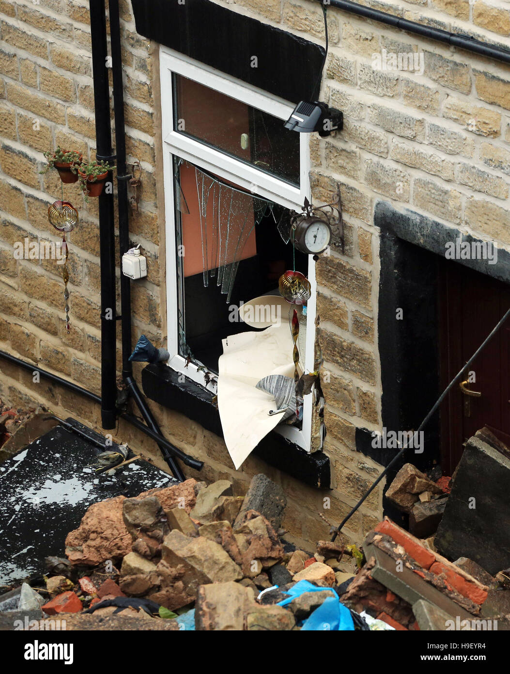 Flood damage at a property in Millbrook near Stalybridge in Greater Manchester after heavy rain overnight, as wind and rain continue to blight parts of Britain threatening further travel chaos after torrential downpours caused flash-flooding and disruption across most of the country. Stock Photo