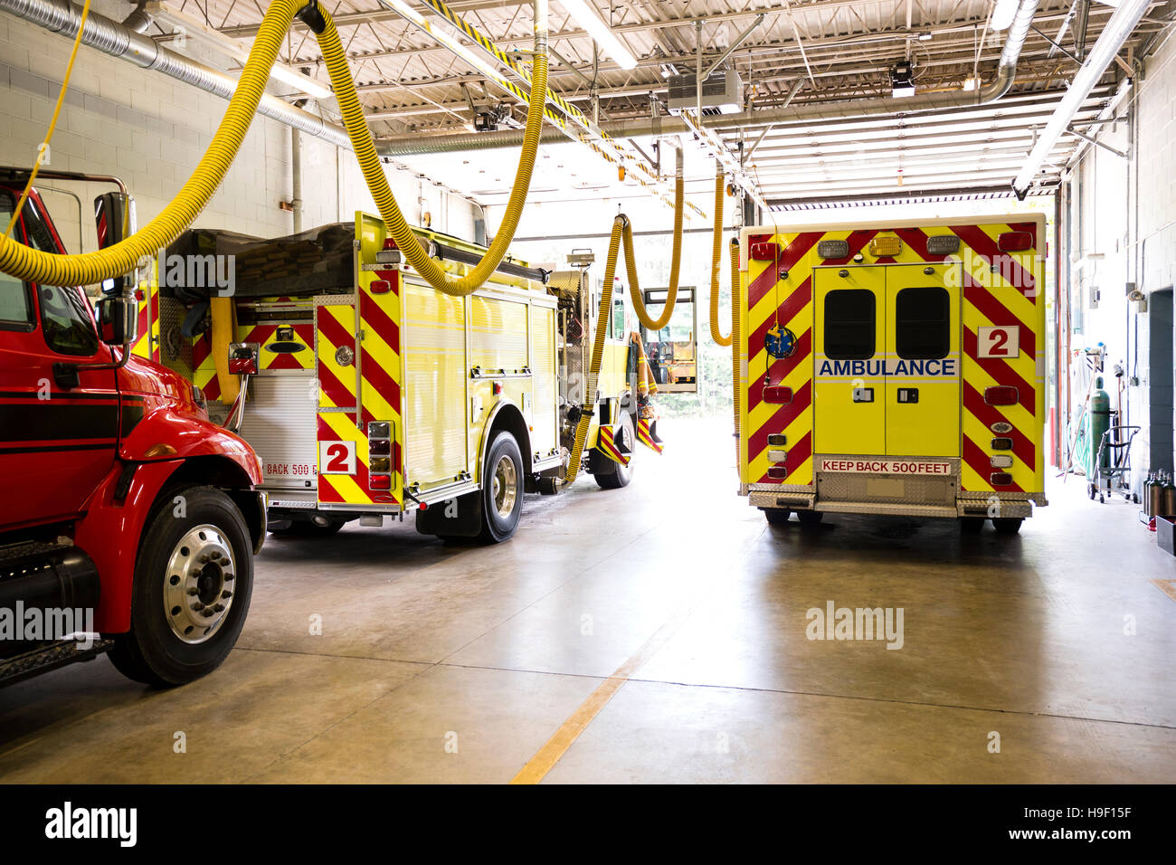 Fire trucks in fire station Stock Photo