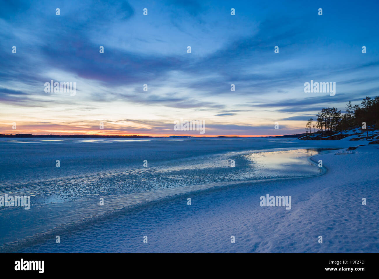 Cold winter landscape at sunset by the lakeside Stock Photo - Alamy