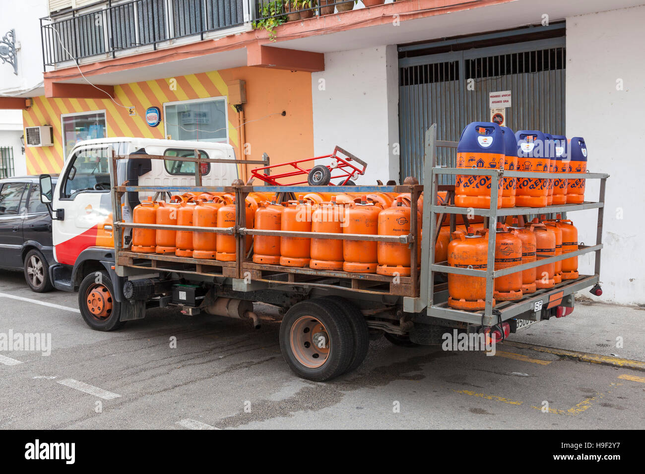 Propane gas bottles delivery truck in the city of Estepona. Costa del Sol, Spain Stock Photo