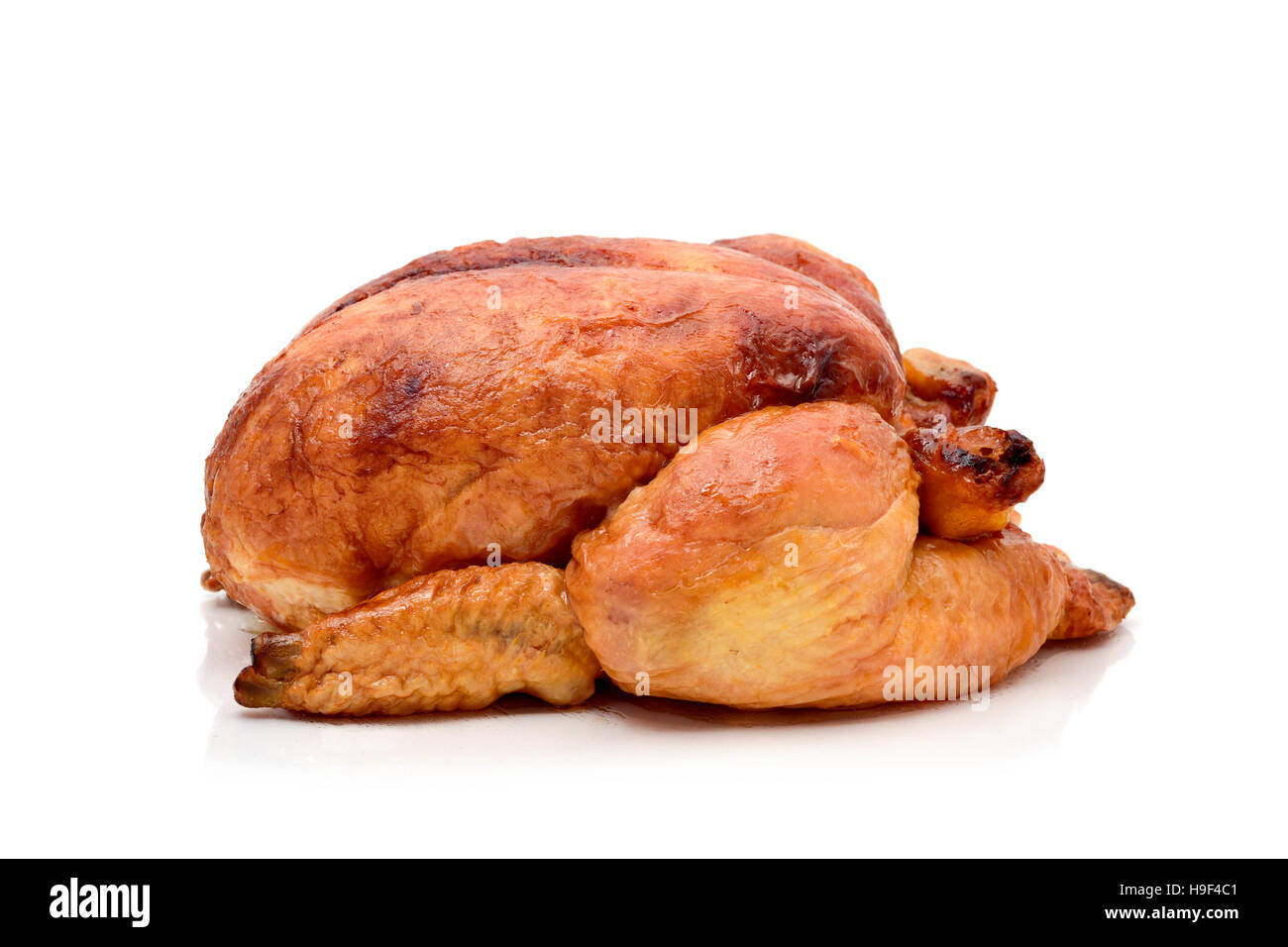 a roast turkey or a roast chicken on a white background Stock Photo
