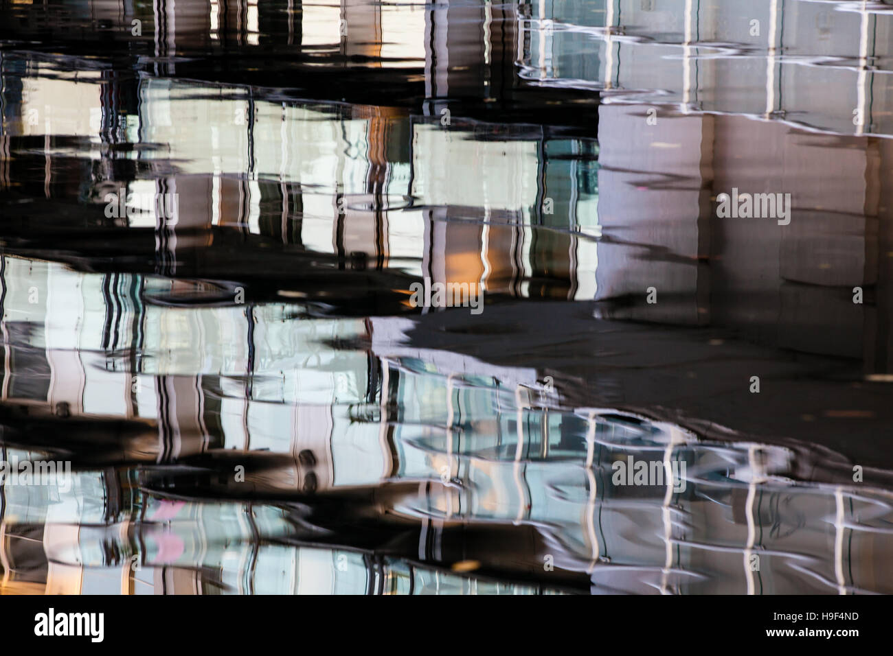 A watery reflection of high value apartments in the Regents Canal. The housing market, housing crash, precarious property Stock Photo