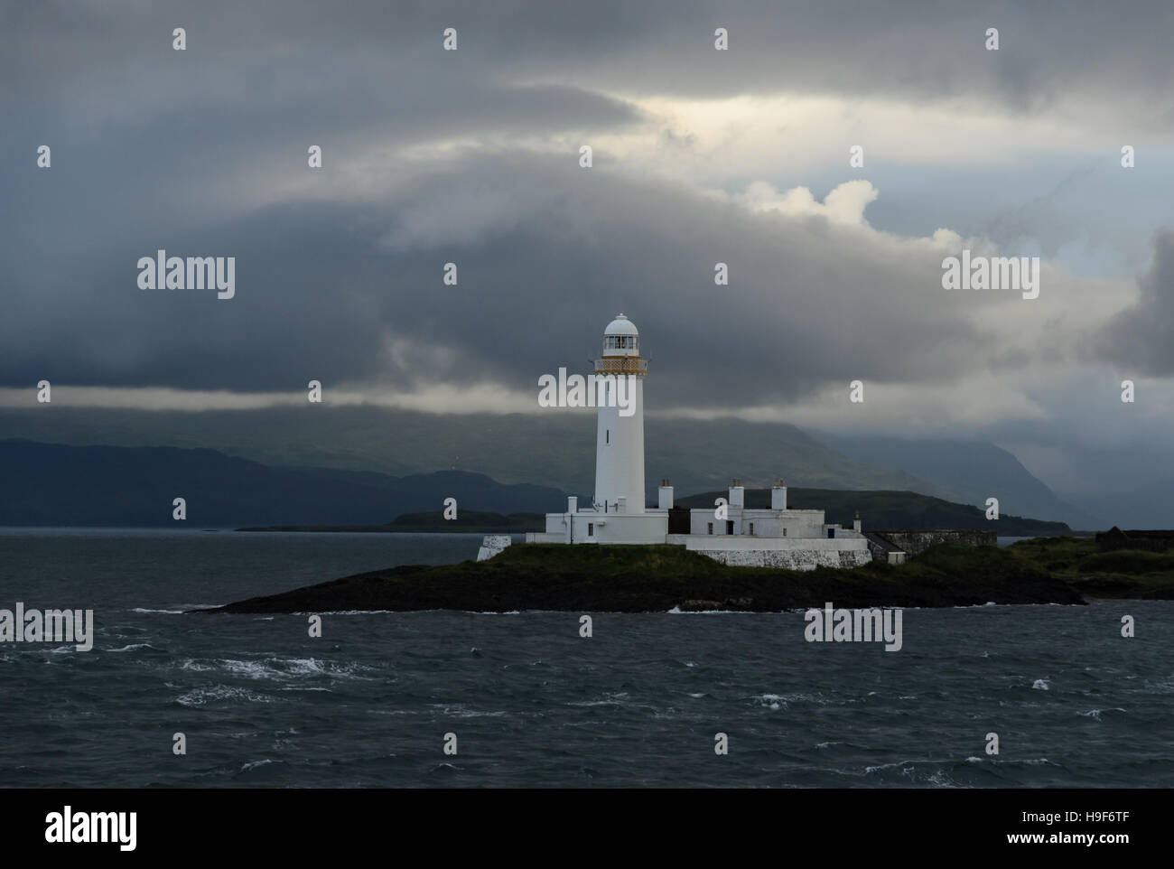 Lighthouse with early morning clouds, Isle of Mull, Scotland Stock Photo