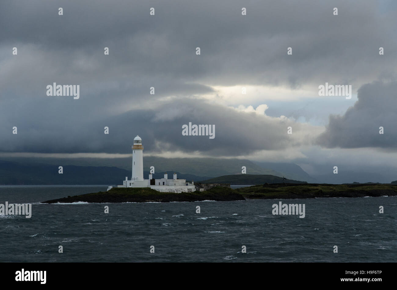 Lighthouse with early morning clouds, Isle of Mull, Scotland Stock Photo