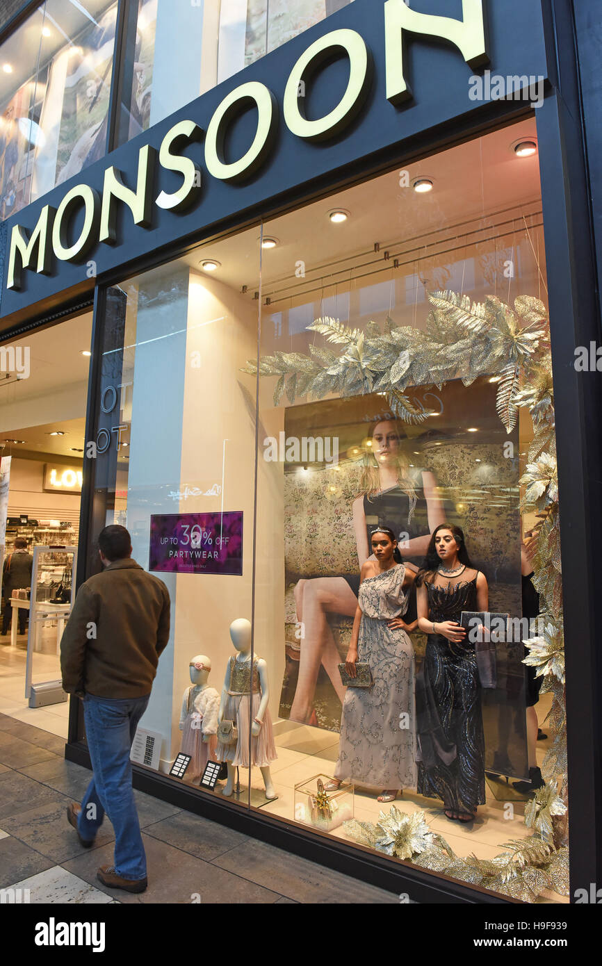 Real life models posing in Monsoon shop window Uk Stock Photo