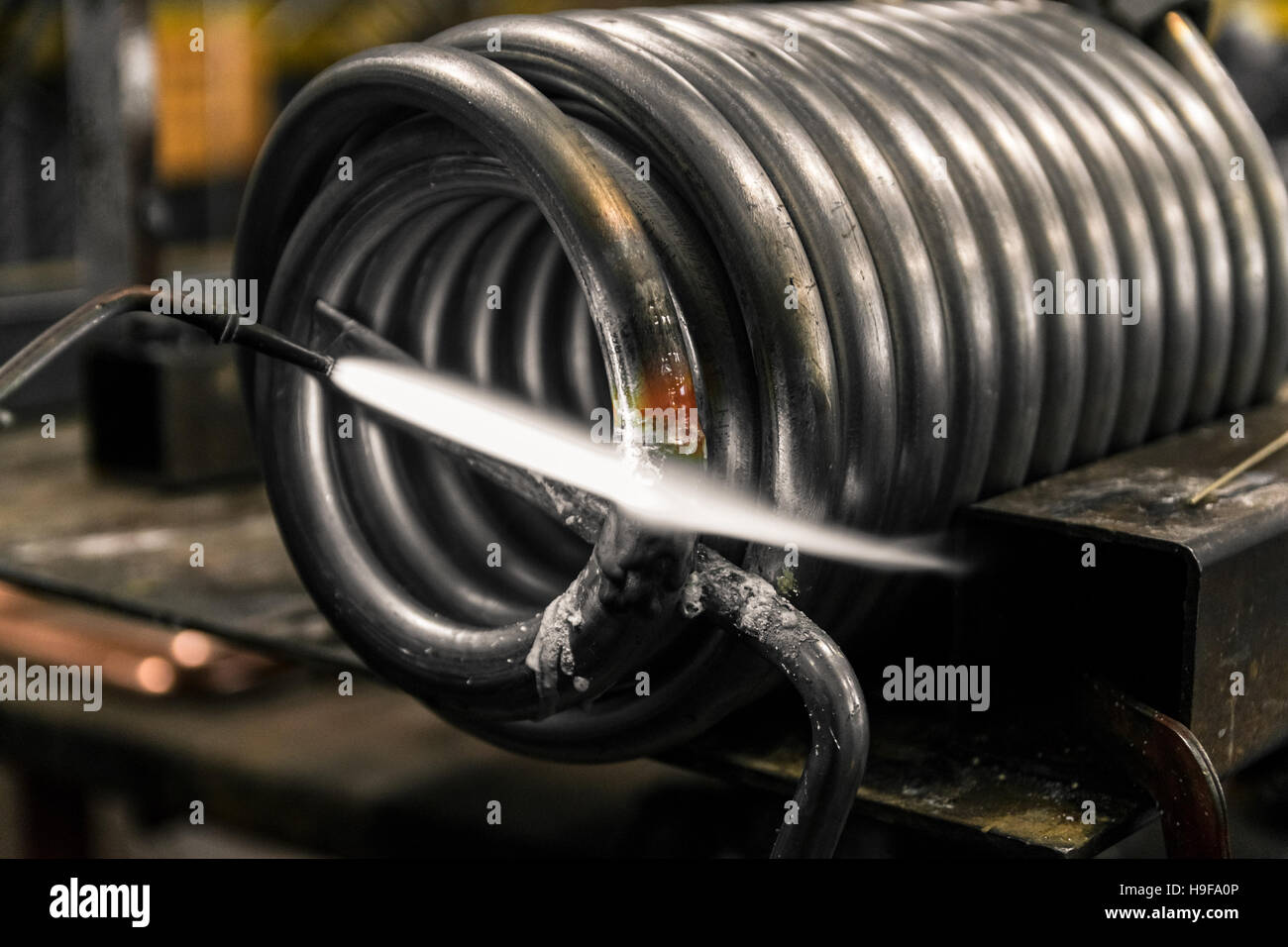 Braze welding process in a metalworking company Stock Photo Alamy