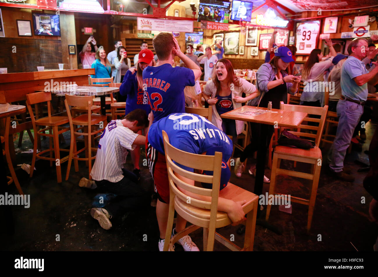 November 2, 2016 - Bloomington, Indiana, USA: Chicago Cubs fans celebrate at Nick's English Hut after the baseball team won the World Series against the Cleveland Indians breaking a 108 year old curse. The Chicago Cubs last won the world series in 1908. Stock Photo