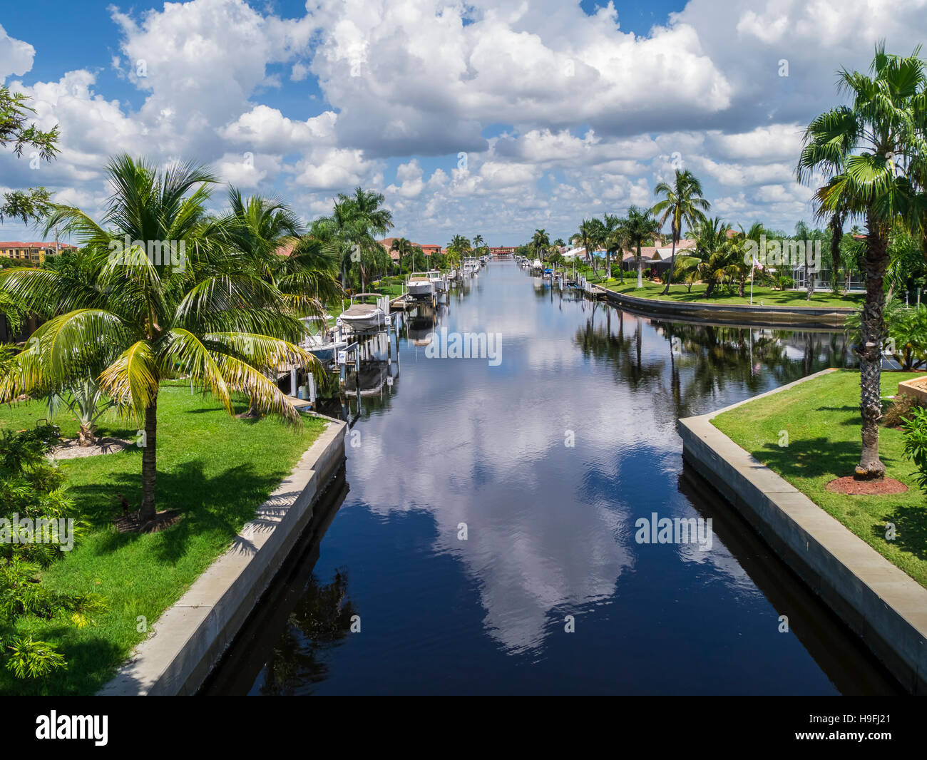 Boats on canals in residential neighborhood of Punta Gorda on the Gulf Coast of Florida Stock Photo