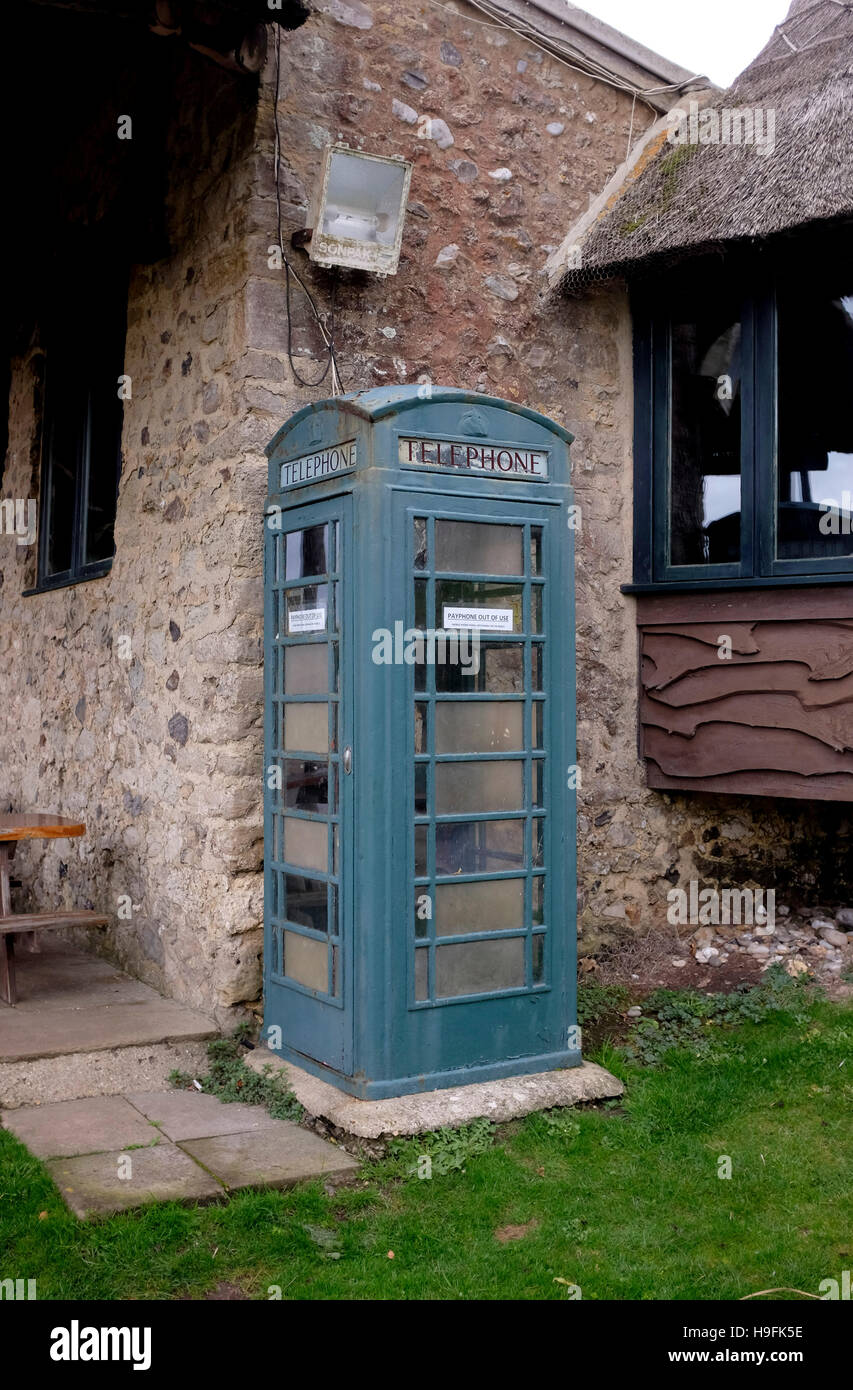 Disused green BT telephone box in Branscombe in East Devon West Country UK Stock Photo