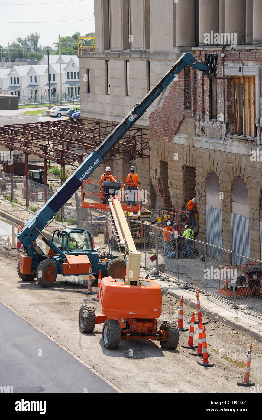 Two CherryPickers and construction crews at work in Omaha, Nebraska