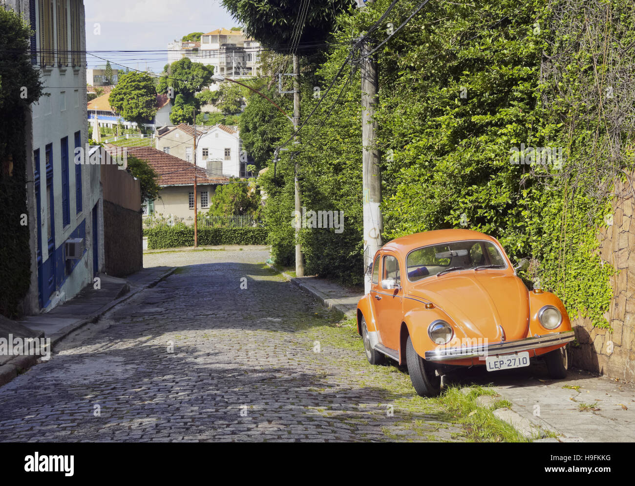 Brazil, City of Rio de Janeiro, Santa Teresa, Orange Volkswagen Beetle on the Rua Monte Alegre. Stock Photo
