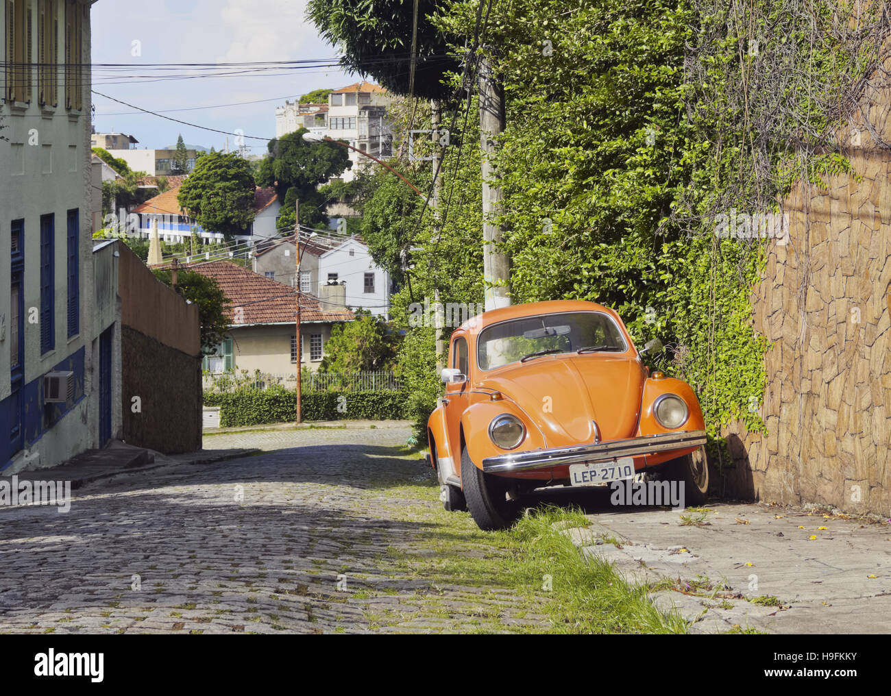 Brazil, City of Rio de Janeiro, Santa Teresa, Orange Volkswagen Beetle on the Rua Monte Alegre. Stock Photo