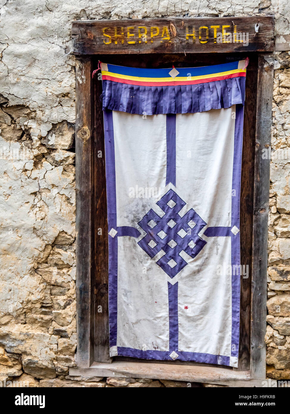 Cloth door covering within wooden frame, Nepal Stock Photo