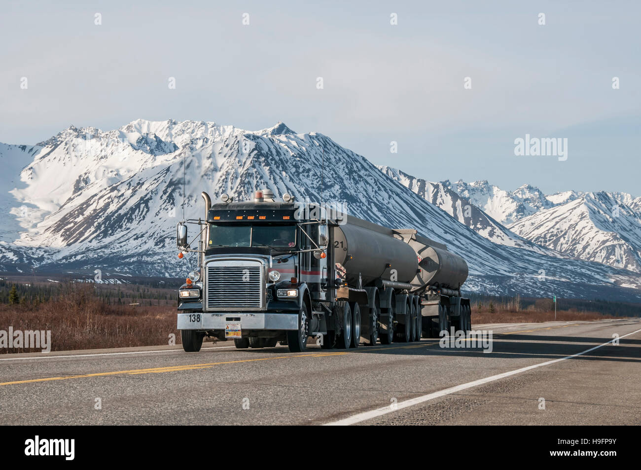 Truck hauling oil on a highway in Alaska. Stock Photo