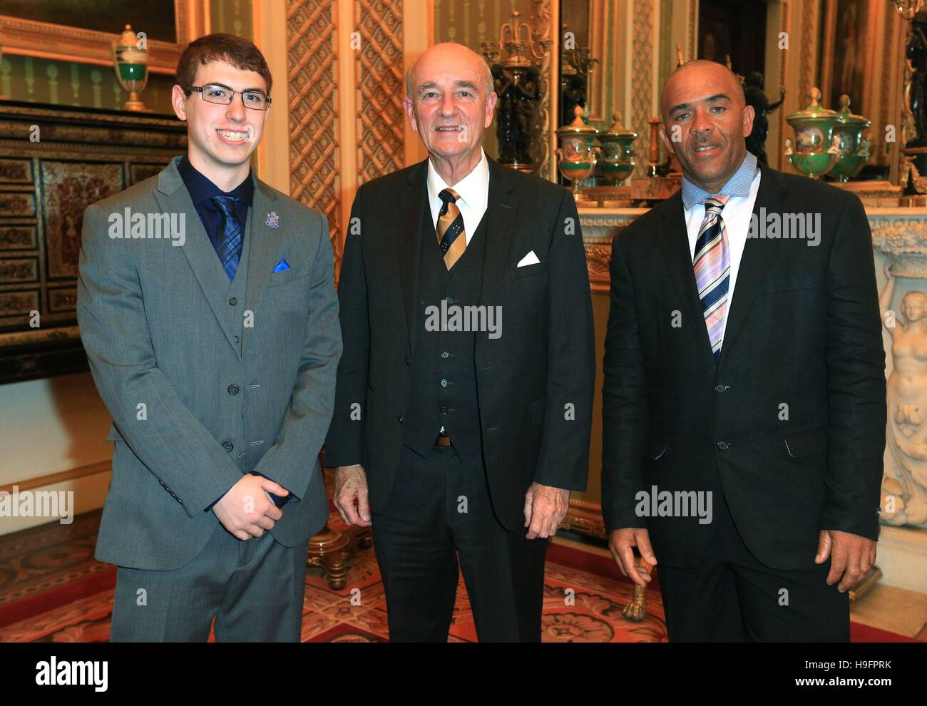 (Left to right) Tyler Bailer, 17, from Canada, Professor John Pearn, from Australia and Zac Dominic, from St Lucia, during a reception held for the Royal Life Saving Society at Buckingham Palace, London. Stock Photo