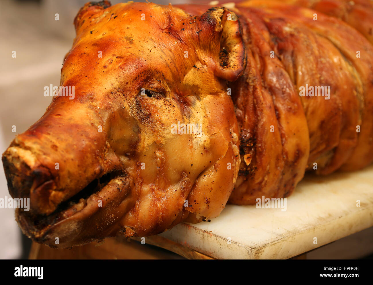 great big roast pork with the big nose in the rotisserie Stock Photo Alamy