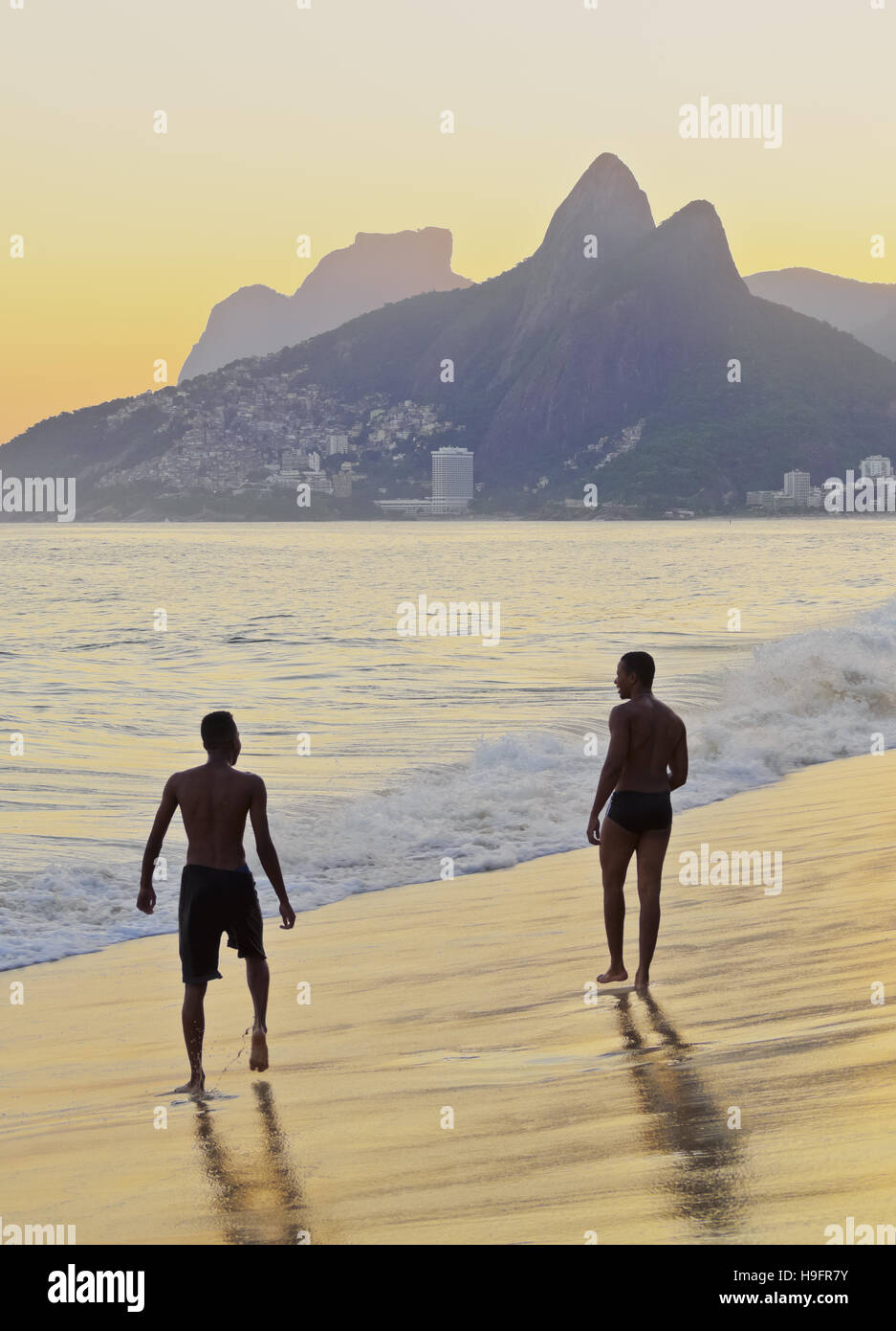 Brazil, City of Rio de Janeiro, Ipanema Beach and Morro Dois Irmaos during sunset. Stock Photo