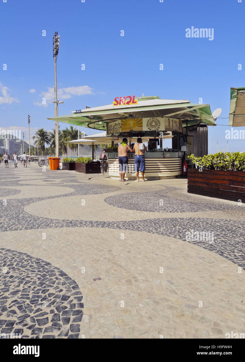 Brazil, City of Rio de Janeiro, Portuguese wave pattern pavement and beach bar at Copacabana. Stock Photo