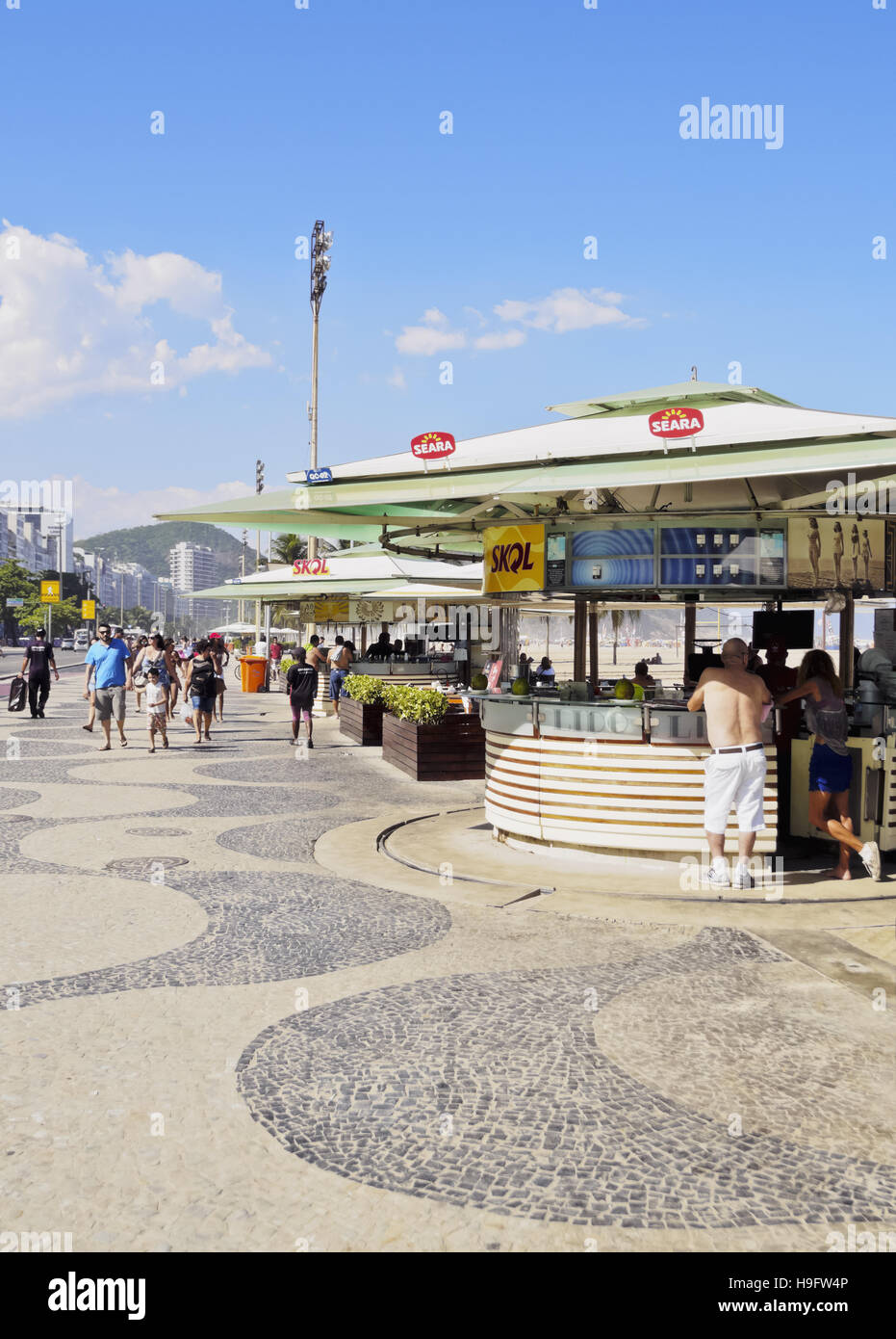 Brazil, City of Rio de Janeiro, Portuguese wave pattern pavement and beach bar at Copacabana. Stock Photo