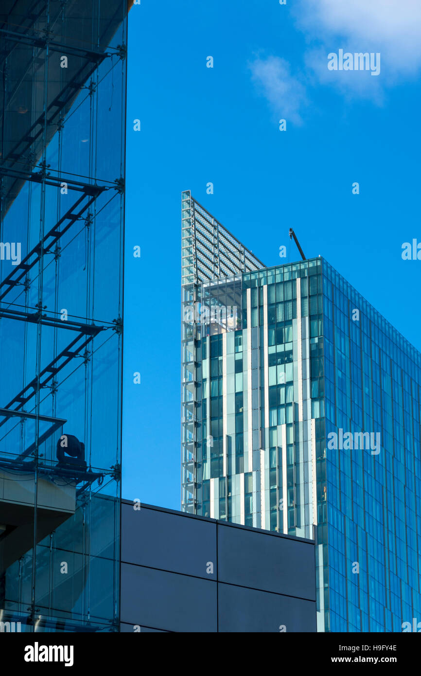 The Beetham Tower and the glass of the atrium of the Bridgewater Hall, Manchester, England, UK Stock Photo