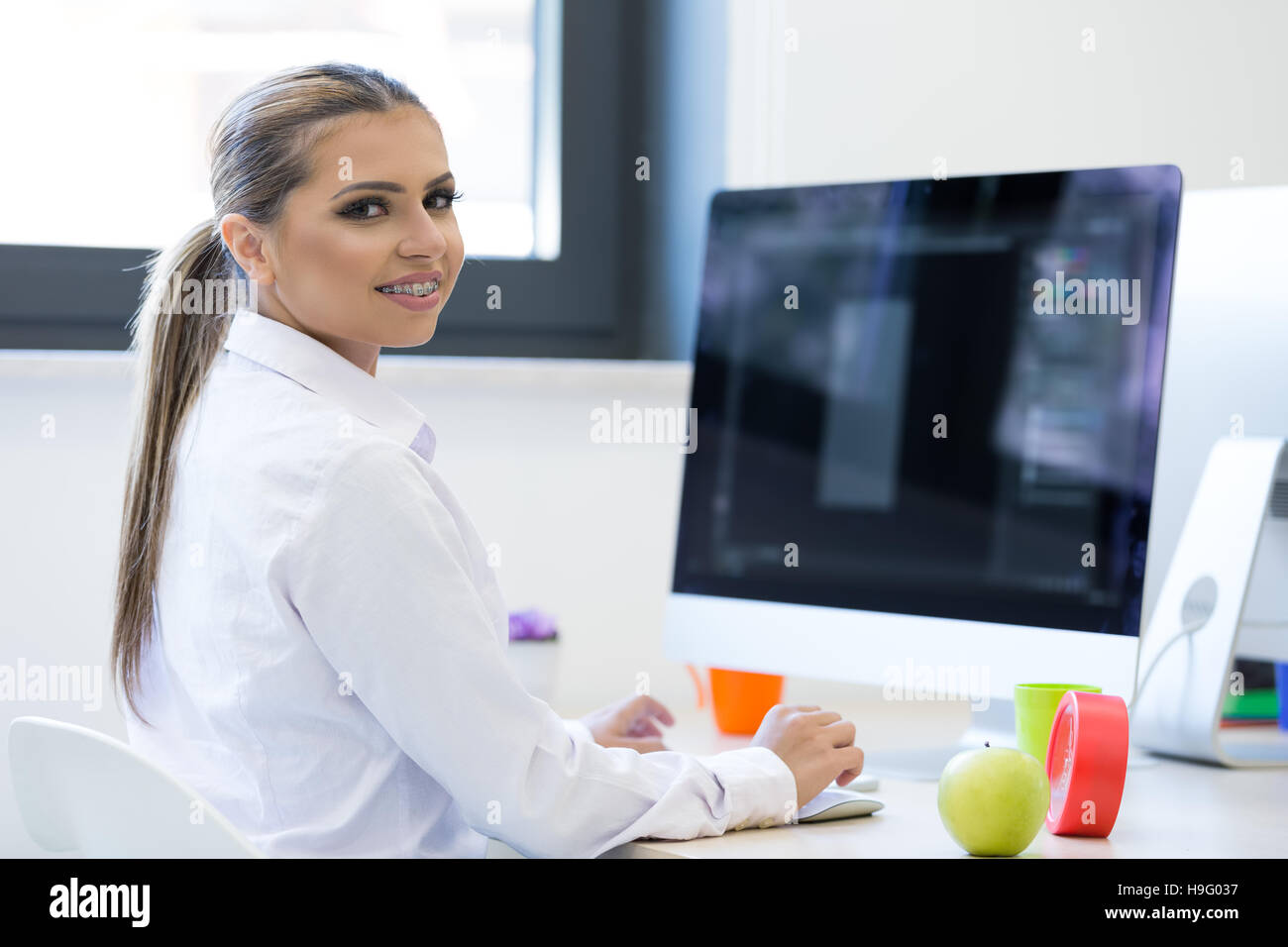 Woman working at computer in an office Stock Photo Alamy
