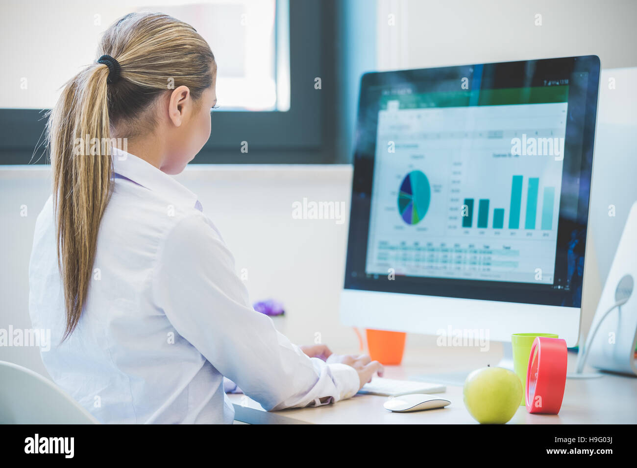 Woman working at computer in an office Stock Photo Alamy