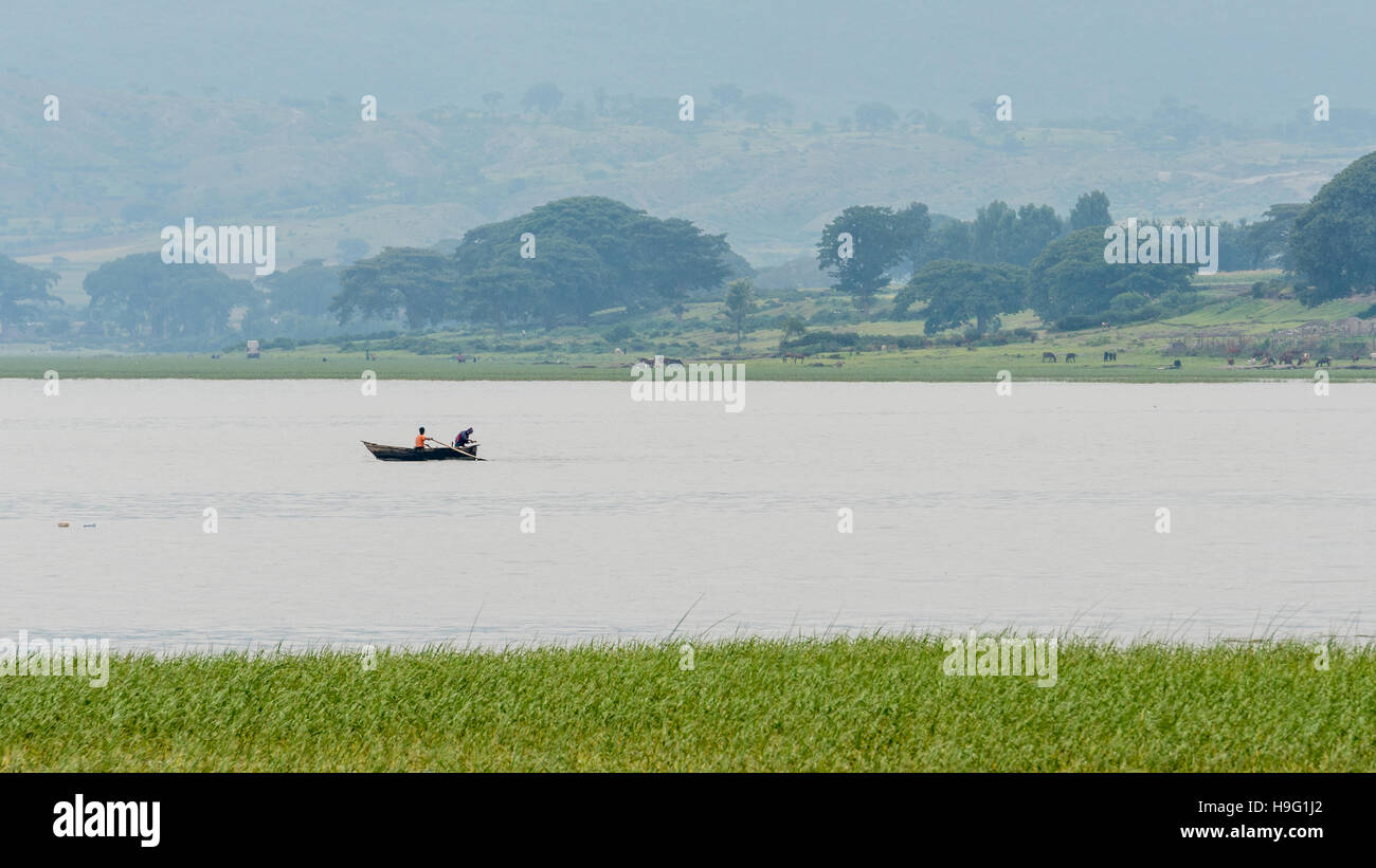 The beautiful Hawassa lake surrounded by lush vegetation and mountains at a distance Stock Photo