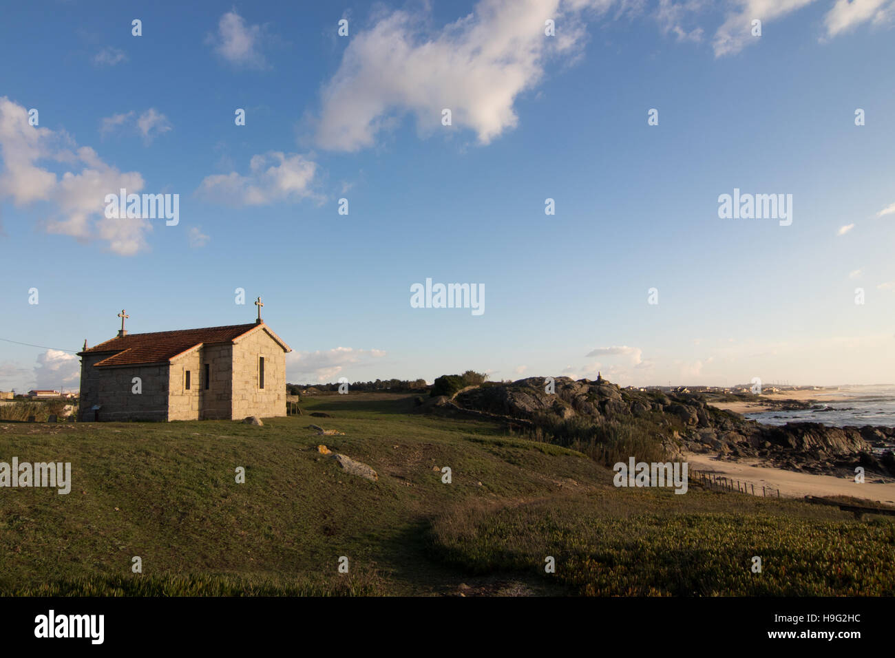 Ancient church and stone cross Stock Photo Alamy
